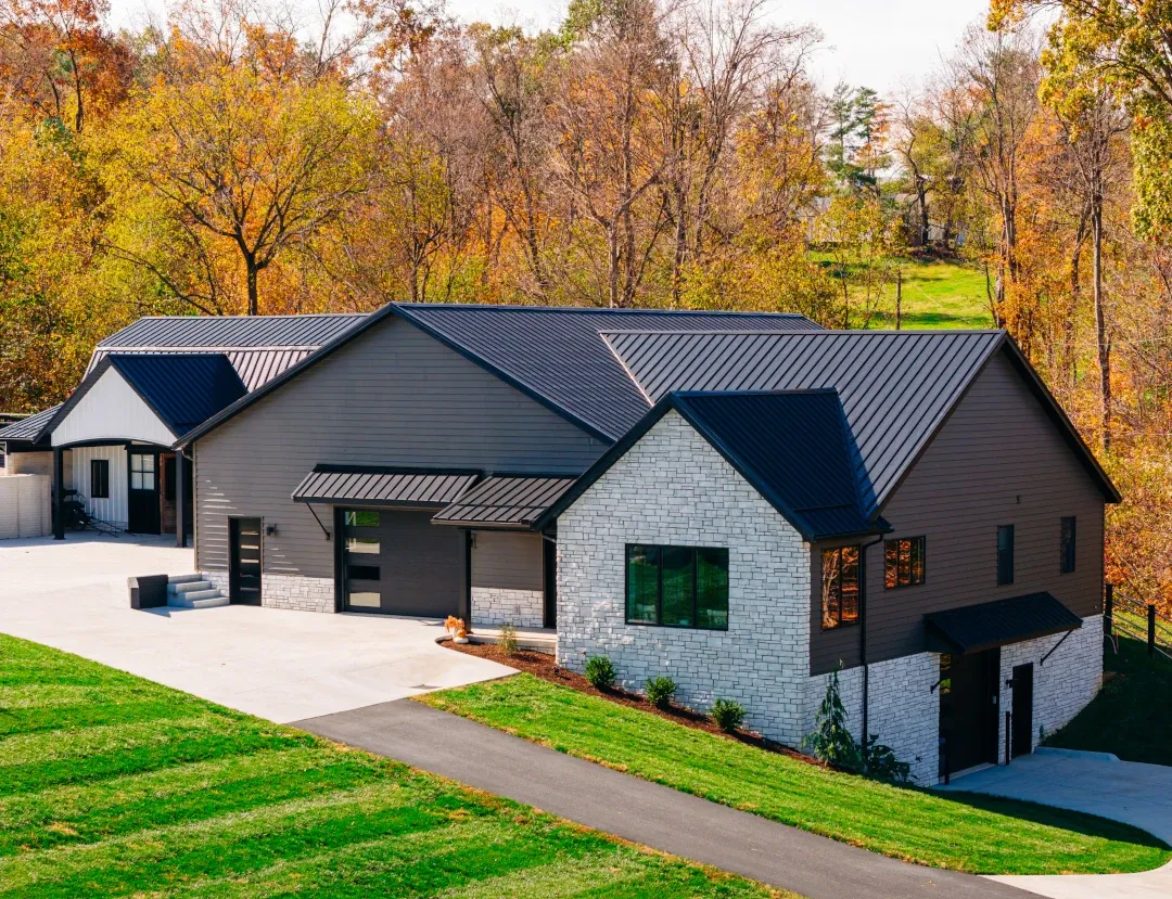 side of home in fall stone veneer siding