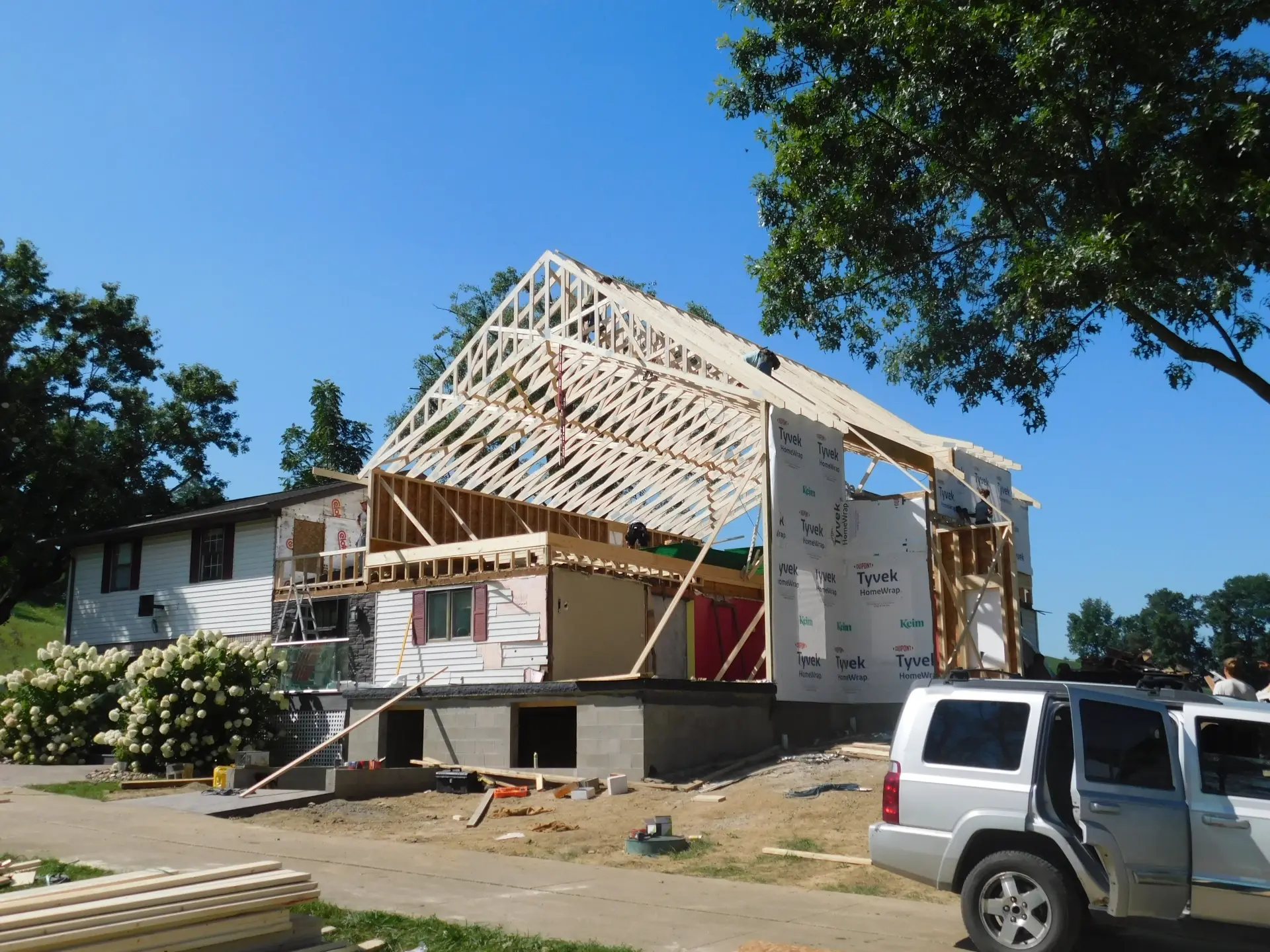 home in middle of construction wooden beam structure