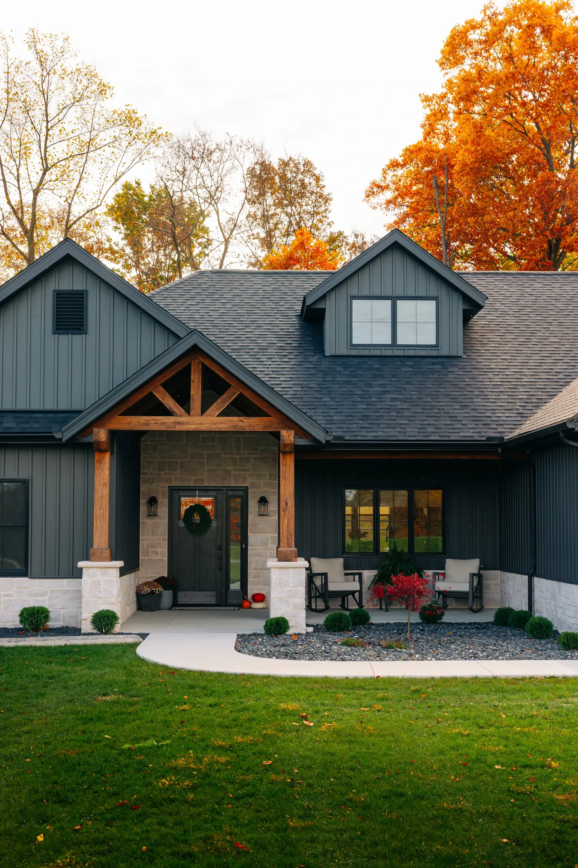 home with timber frame entrance and front patio