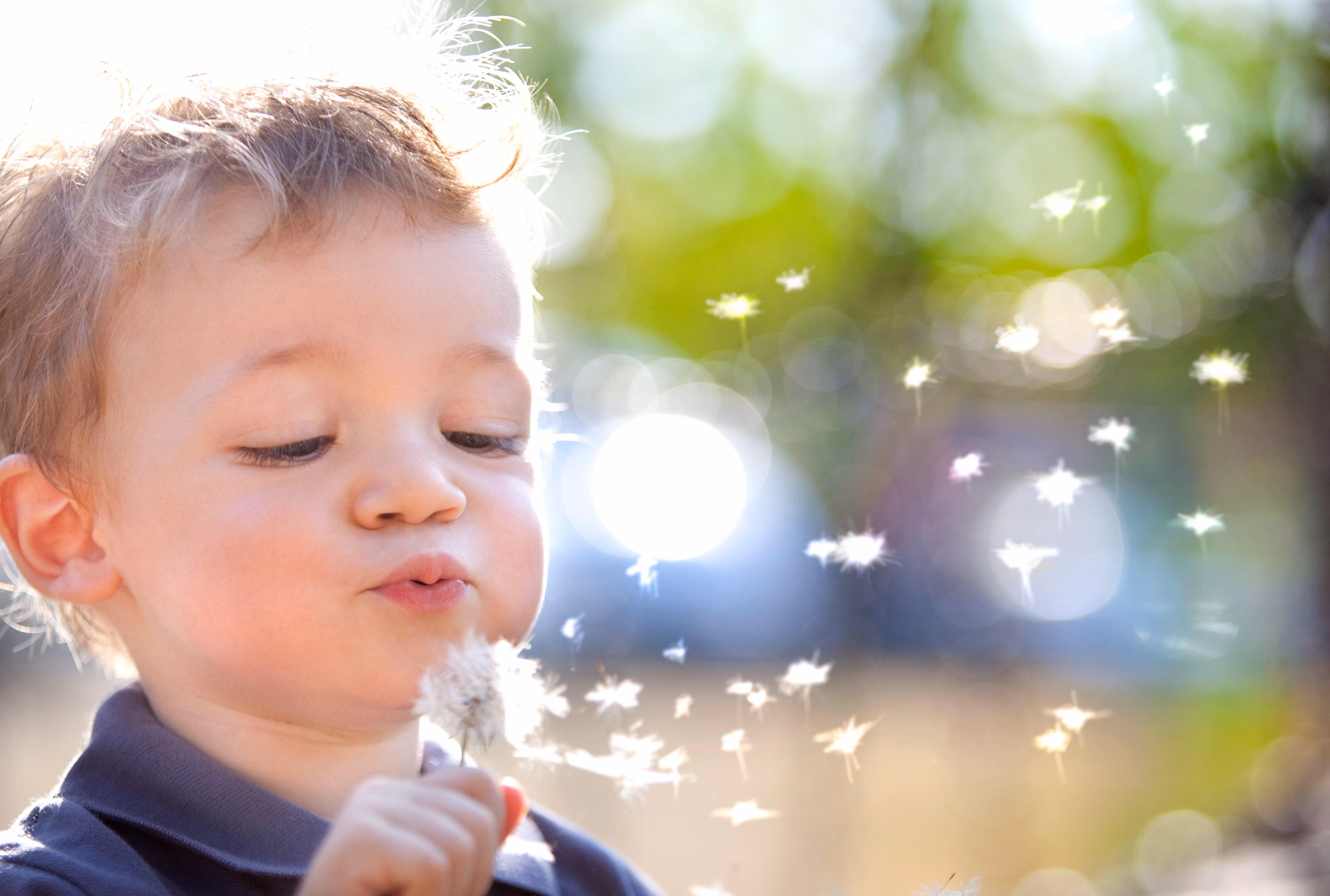 Kid blowing bubbles stock image