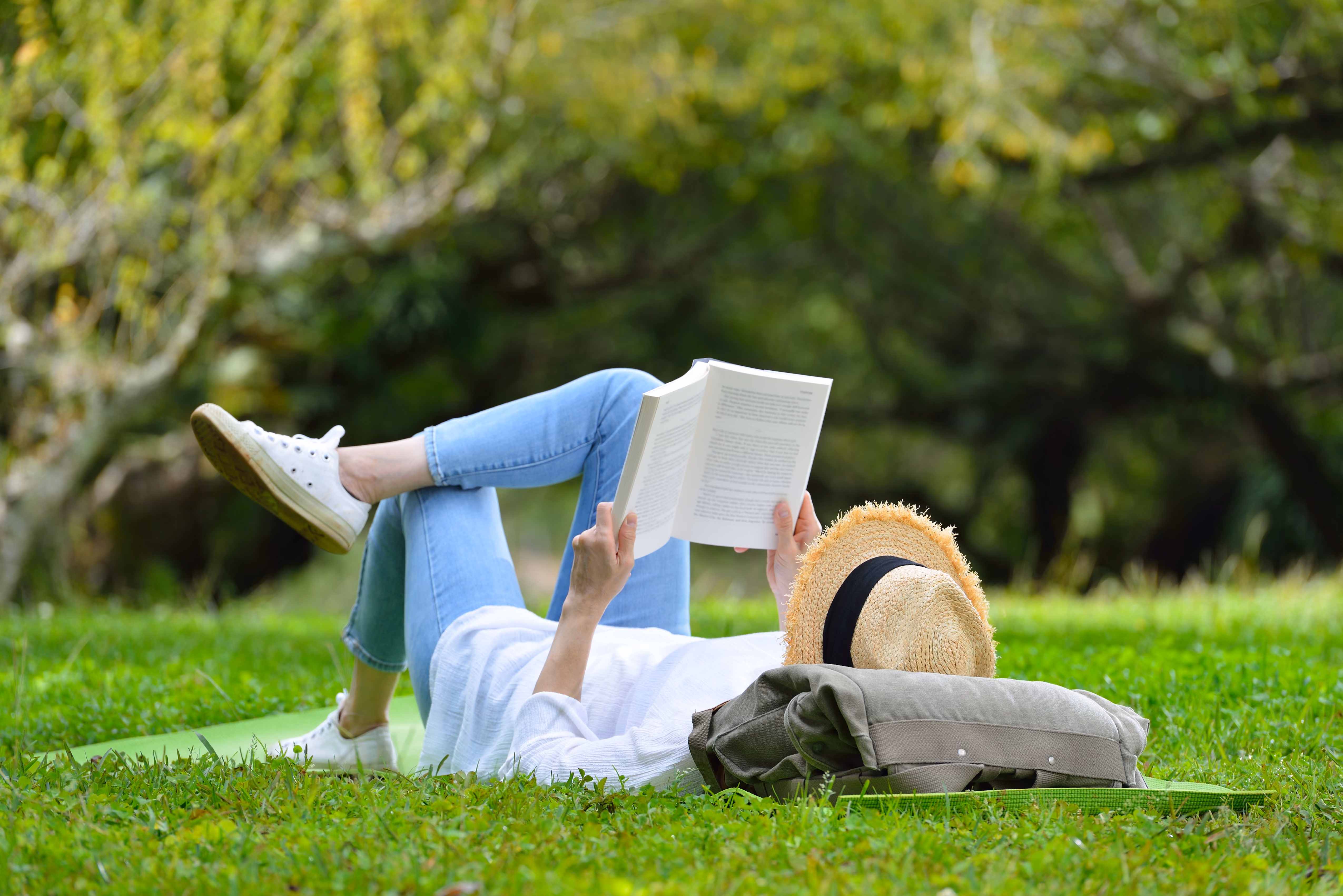 Woman laying in the park stock image