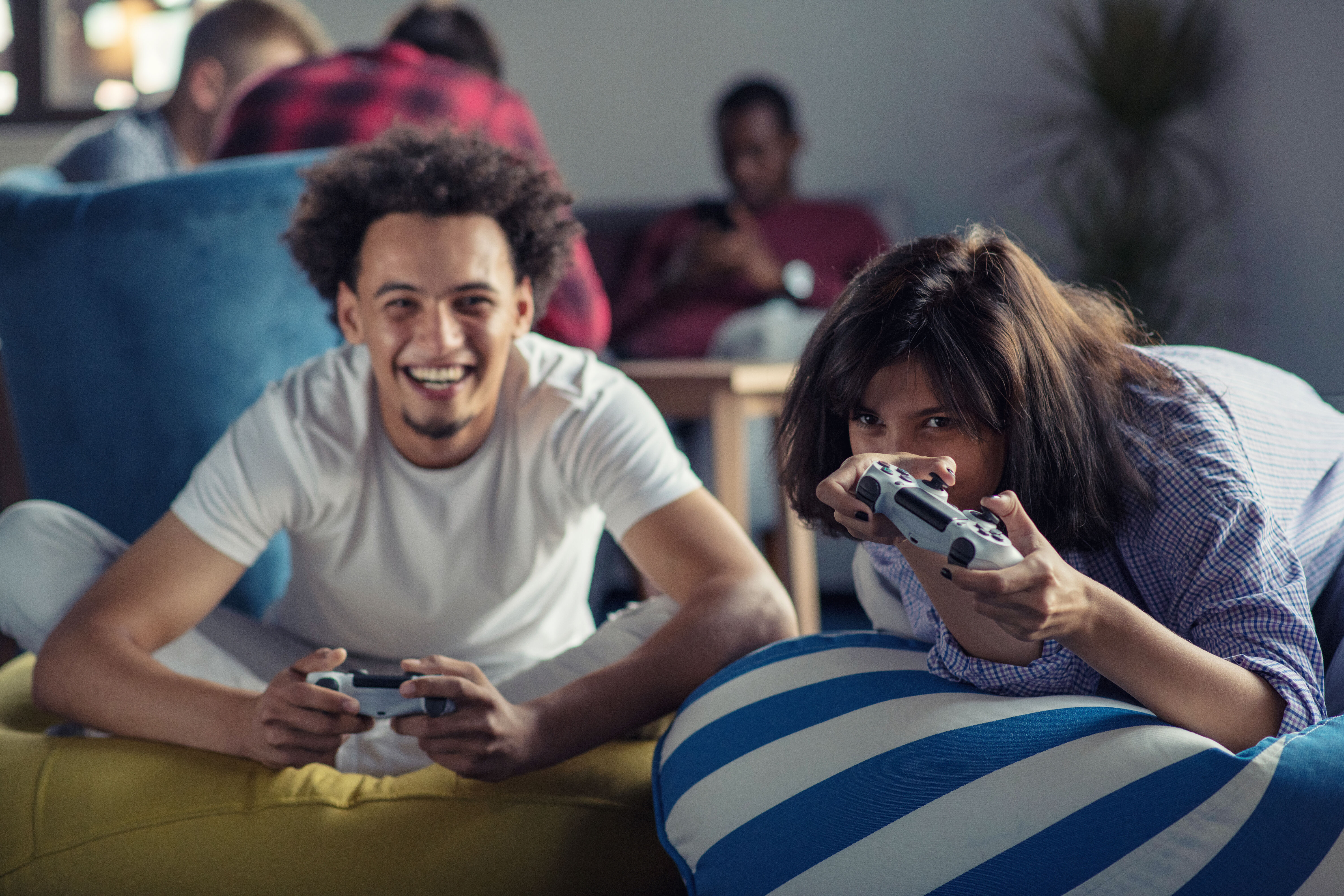 Boy and girl playing video game stock image