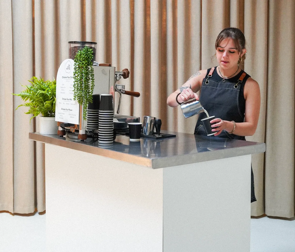 Barista serving from a Vim espresso cart