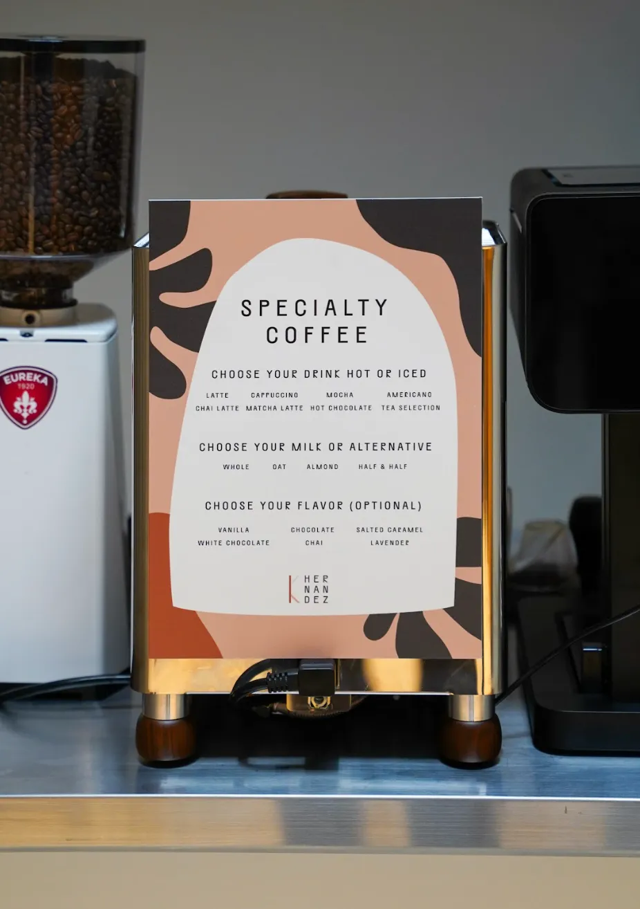 Custom-printed specialty coffee menu board mounted on the espresso machine