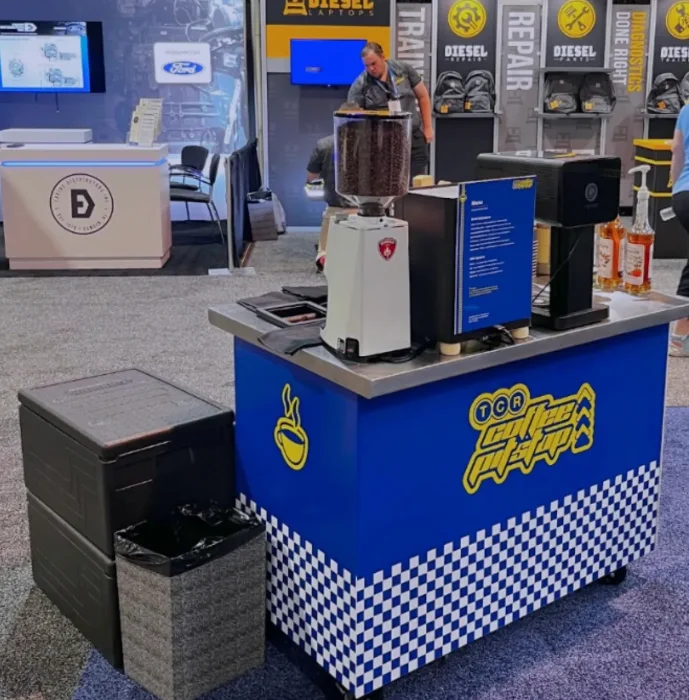 Coffee catering setup inside a convention booth