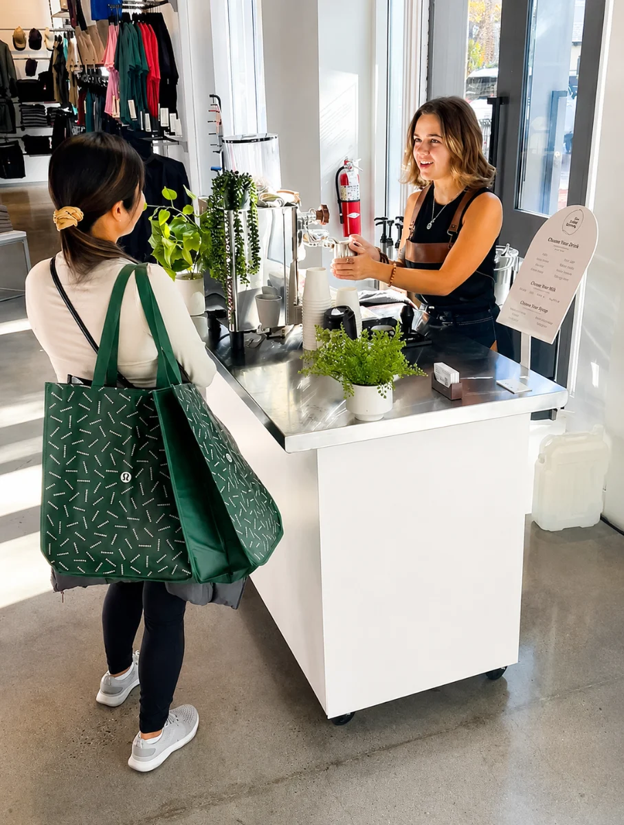 Vim barista making espresso drinks at a mobile coffee cart