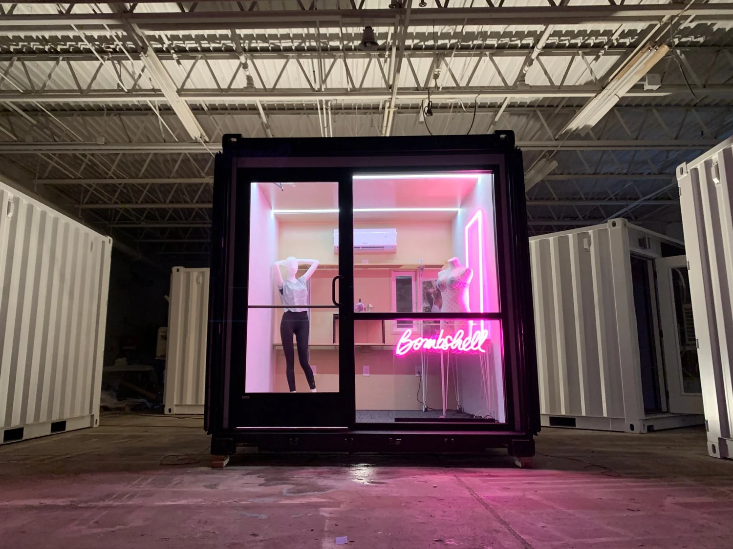A custom-built ootBox retail showroom with neon signage