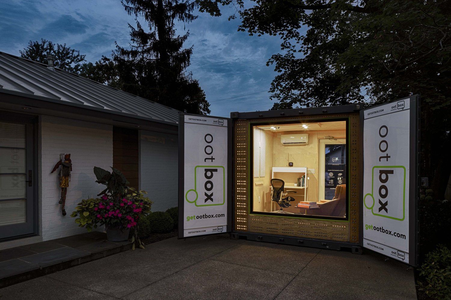 An ootBox in a residential driveway at dusk