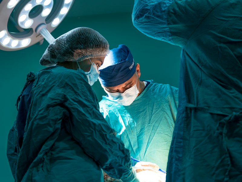Surgical team performing a procedure in an operating room