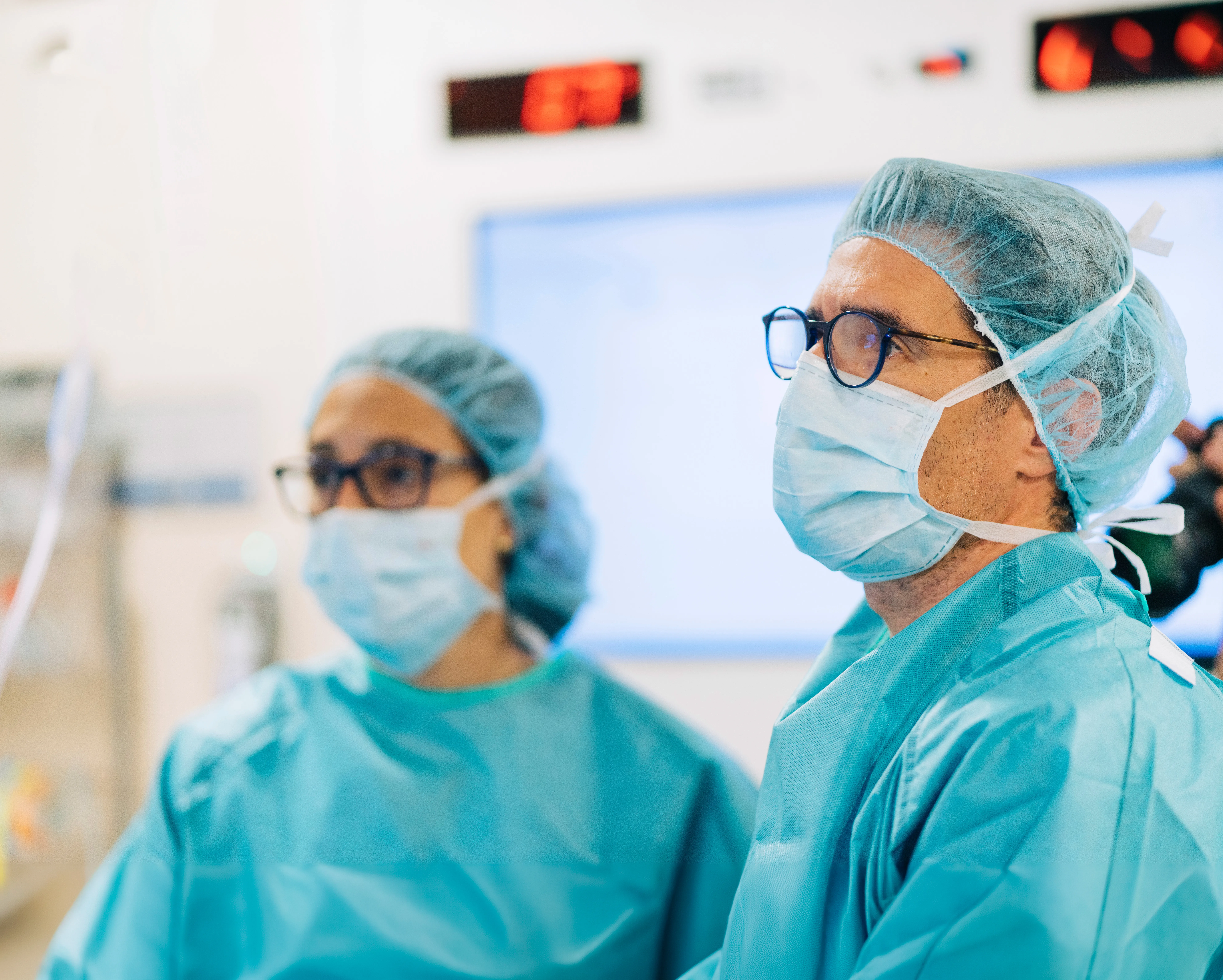 Surgeons in masks preparing for surgery