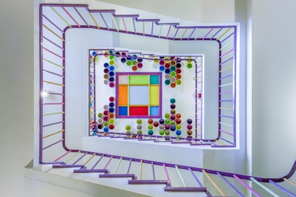 Colourful stairwell viewed from below