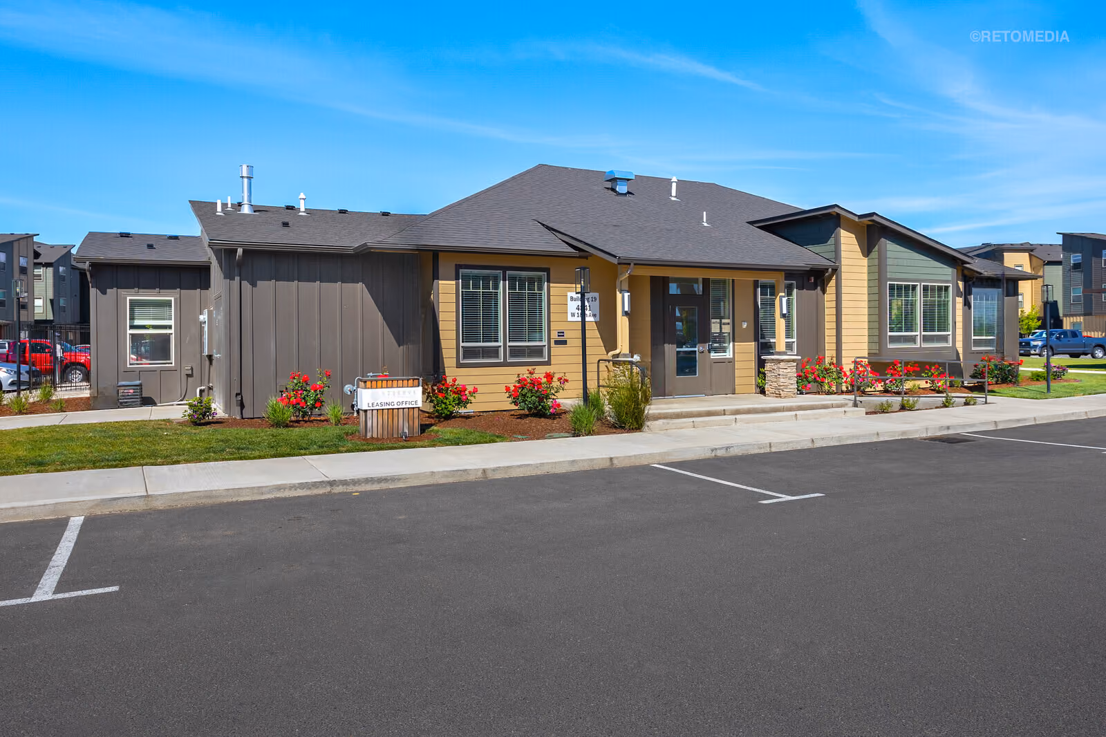 Building Exterior at Reserve at Hunters Ridge, with a parking lot at Eugene, Oregon