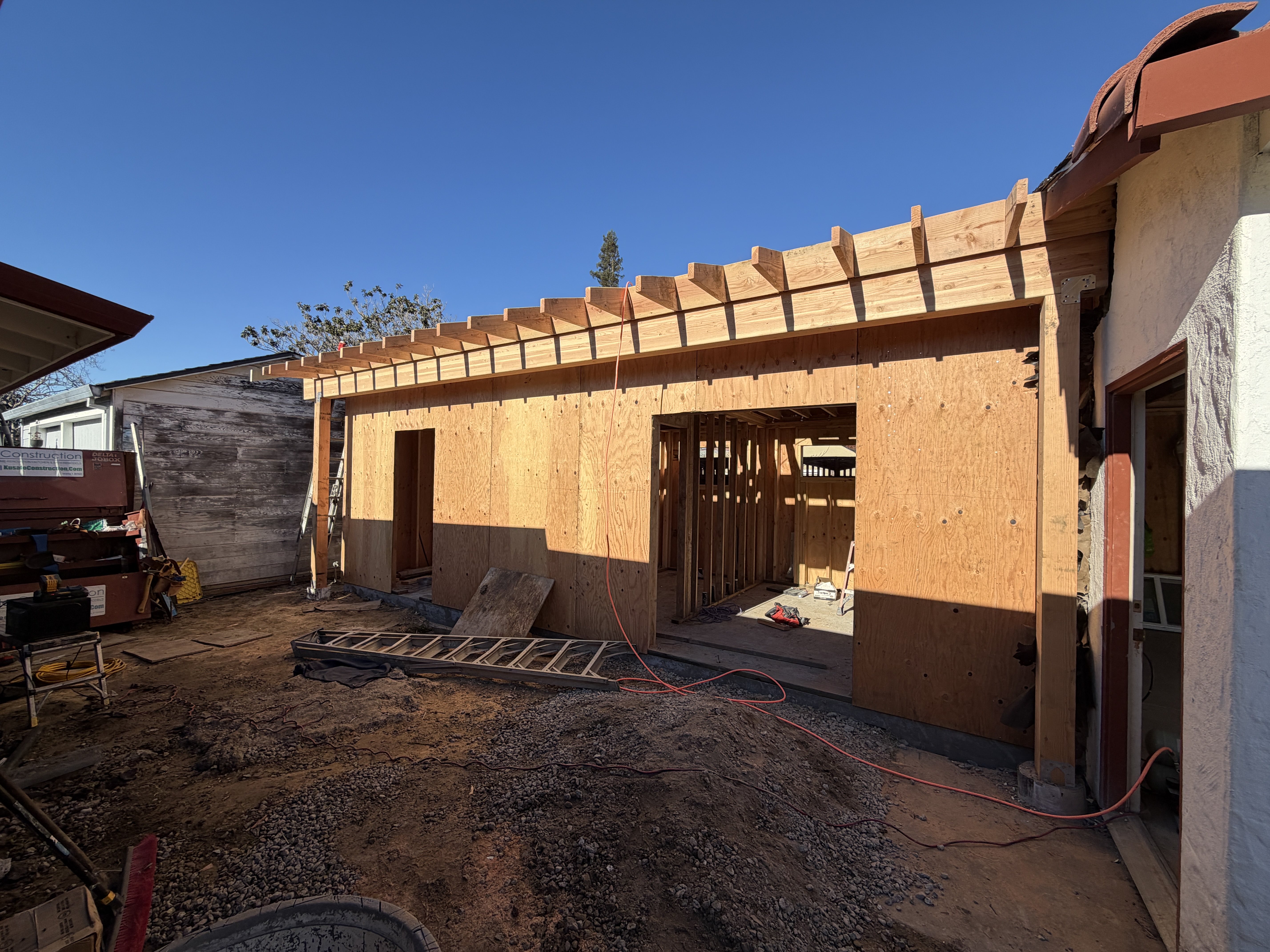 Construction progress photograph — wood framing and wall sheathing for the California Ave Garage Attached ADU in San Jose.