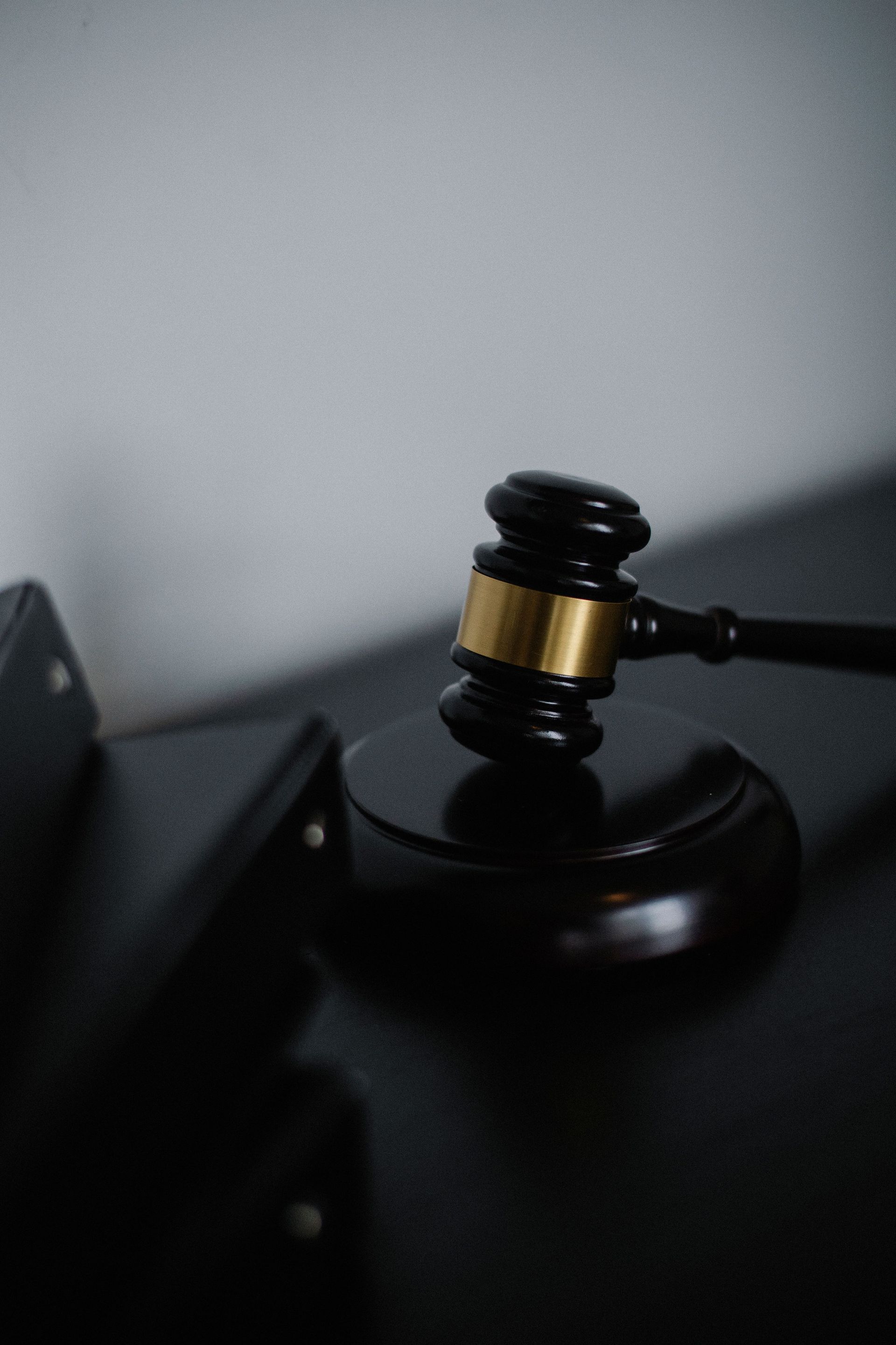 black and gold gavel on a desk