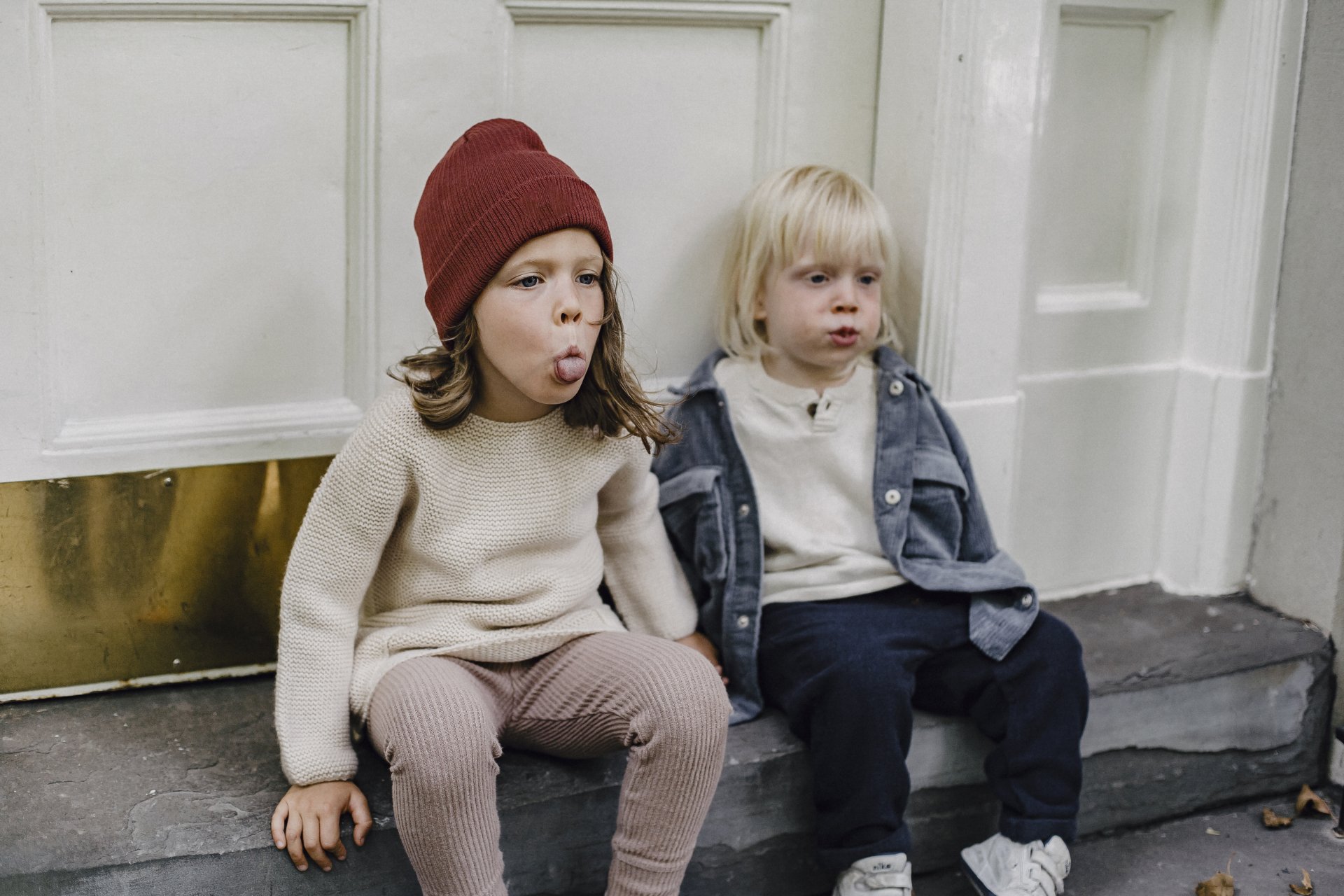 Step-children play outside of a home