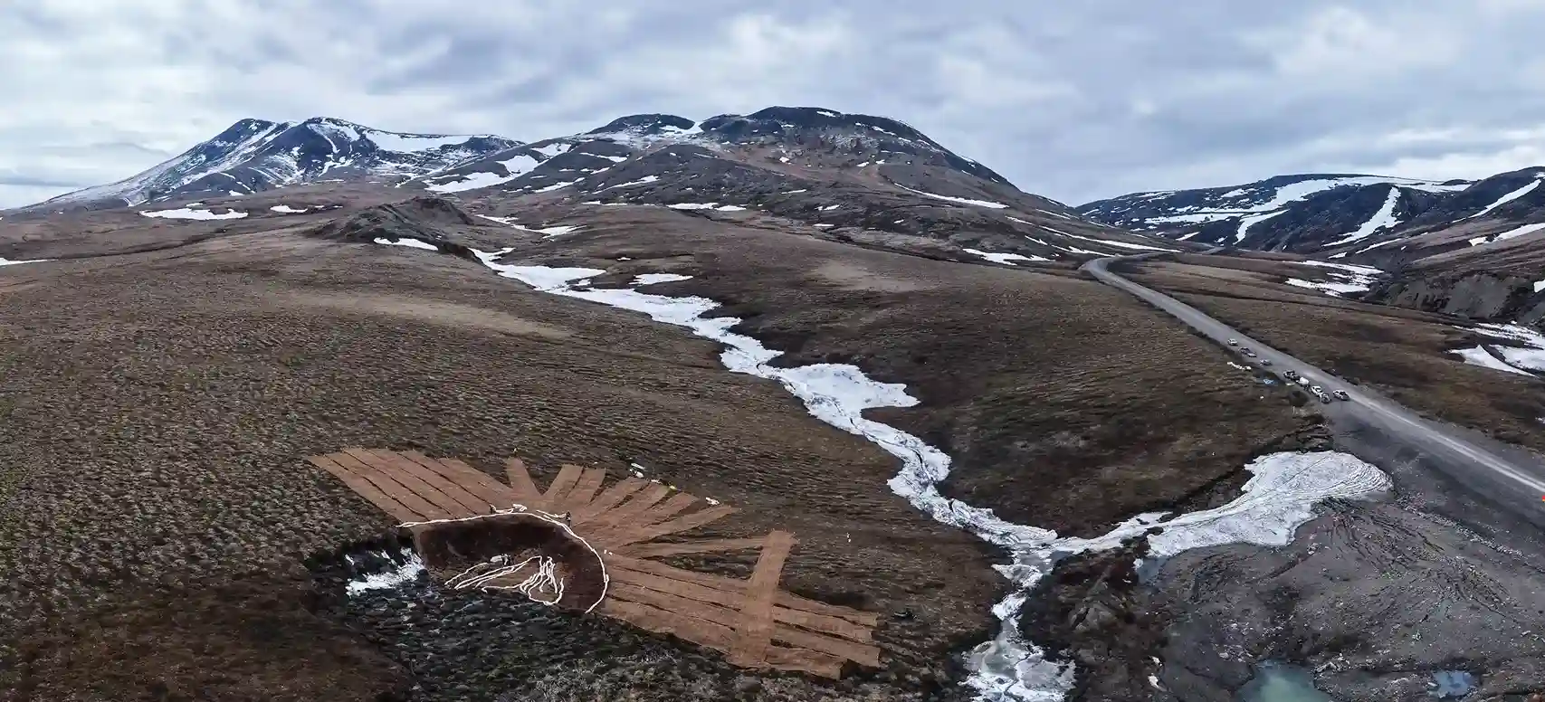 Aerial view of the Green Blanket laid in overlapping strips across a thaw slump and the ground above it