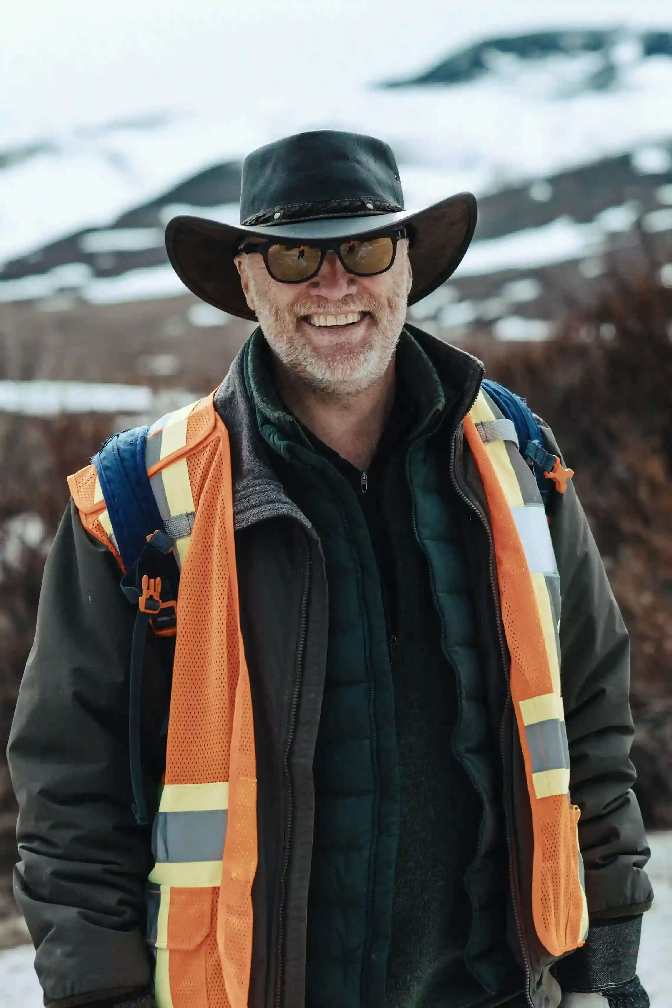 Portrait of Paul Cooper beside a truck bed on the tundra