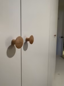 Close-up of IKEA PAX wardrobe installed in Vancouver with sleek door knob detail.