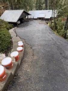 Asphalt buckets on driveway stairs