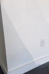 A wall with an outlet