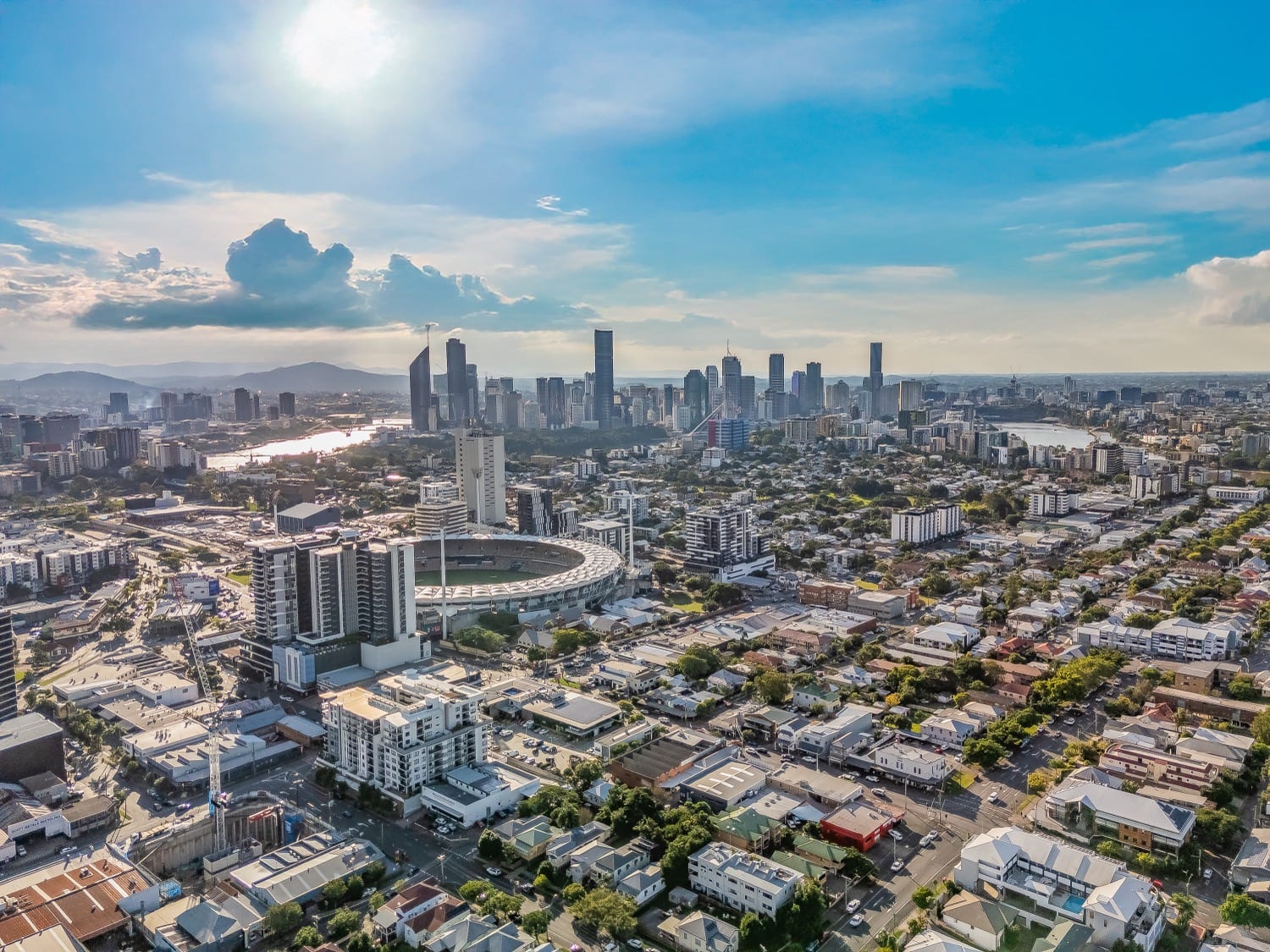 Aerial view of East Brisbane and the Gabba stadium with the Brisbane CBD behind
