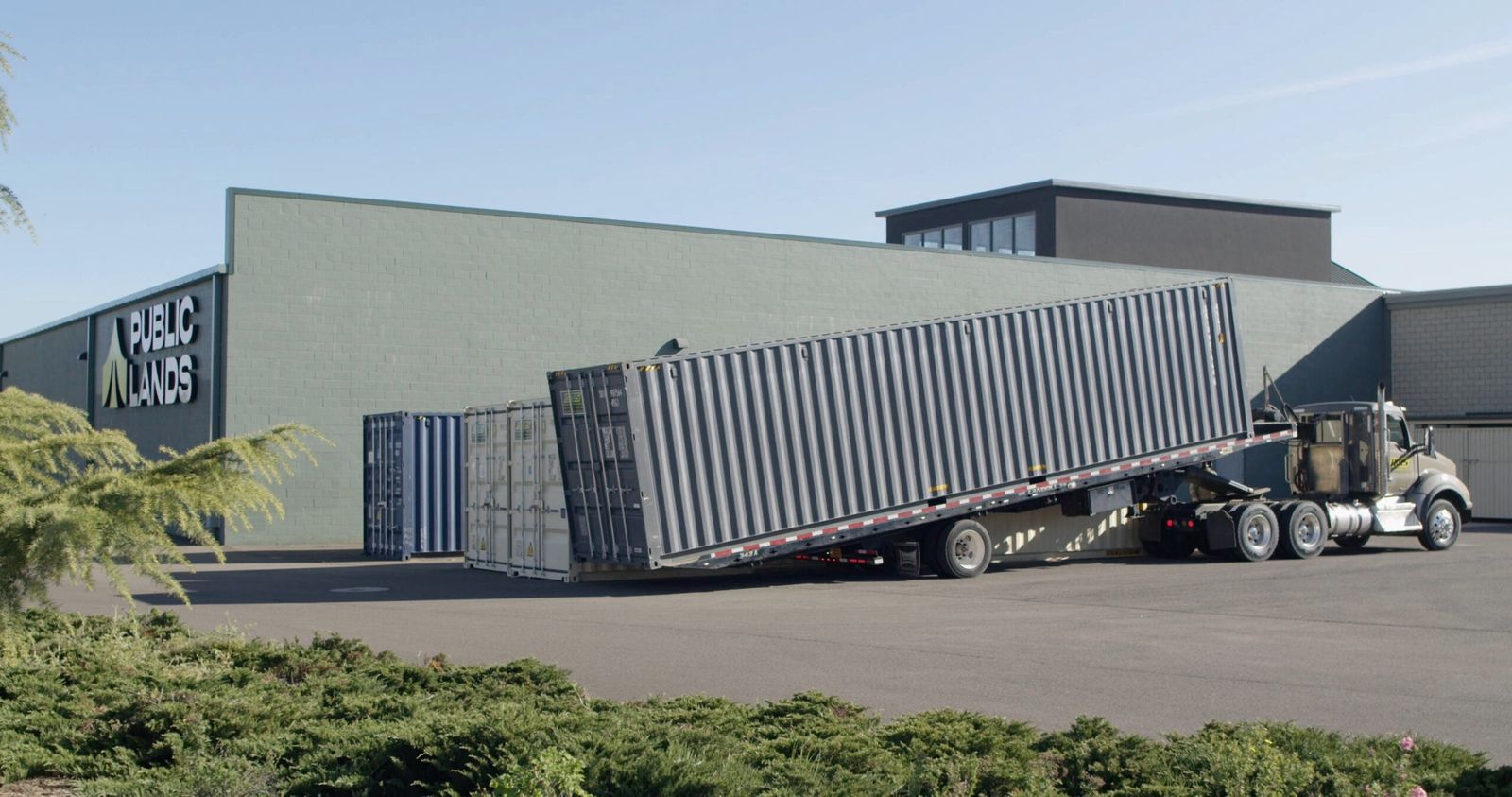 Storage container set level on a gravel pad