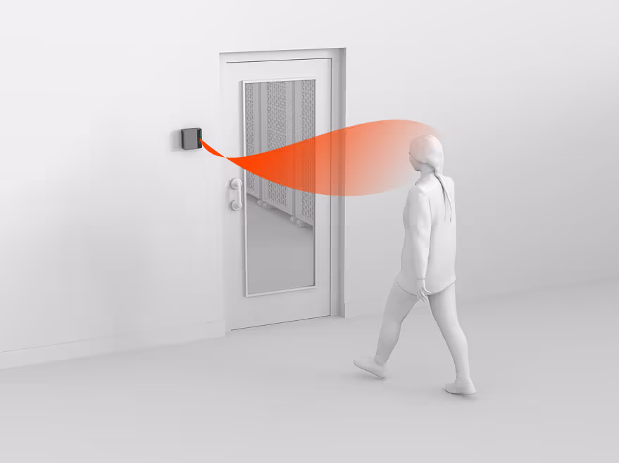 Illustration of a figure walking toward a door, an orange beam linking them to a wall-mounted reader