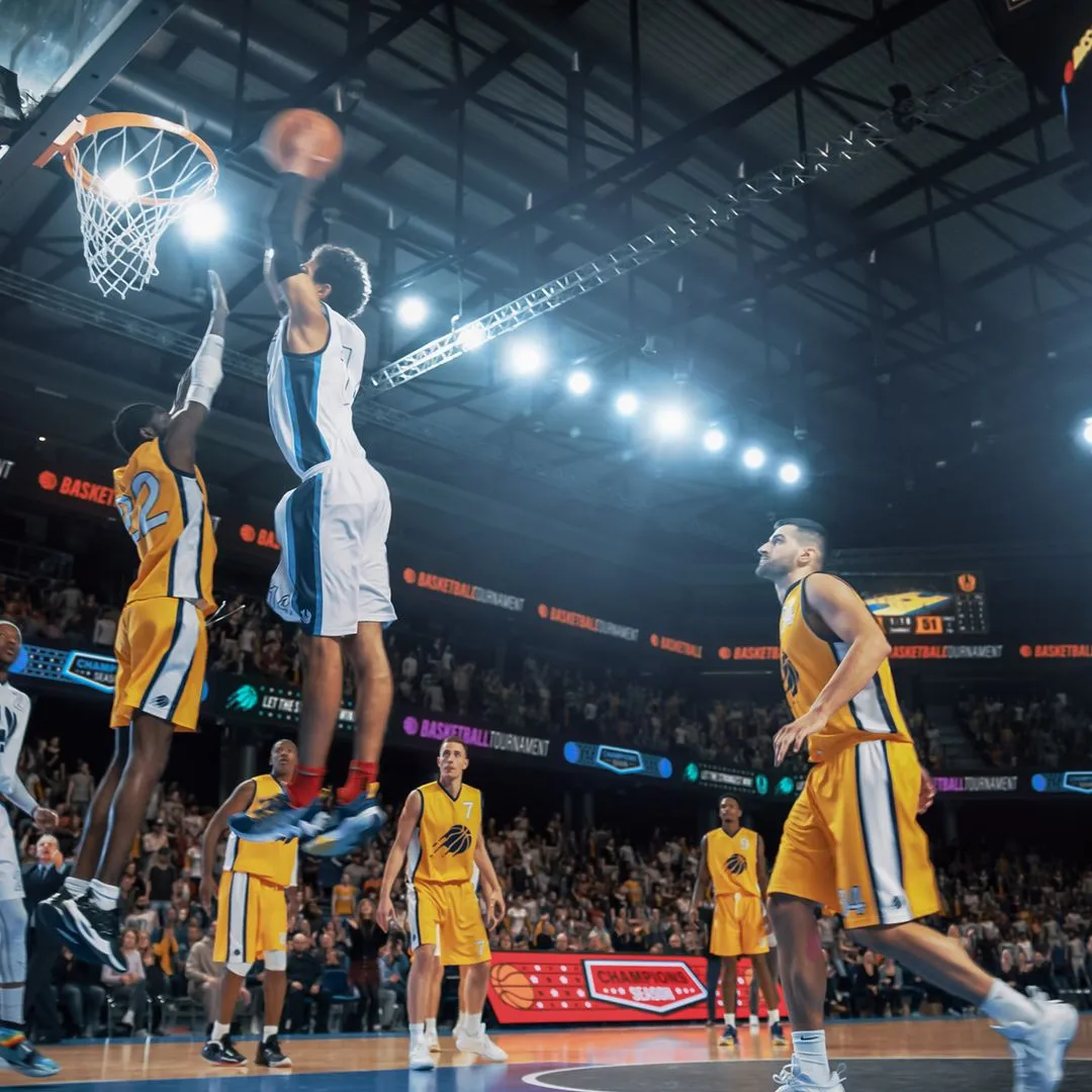 A basketball player leaping to score at the hoop during a packed indoor arena game
