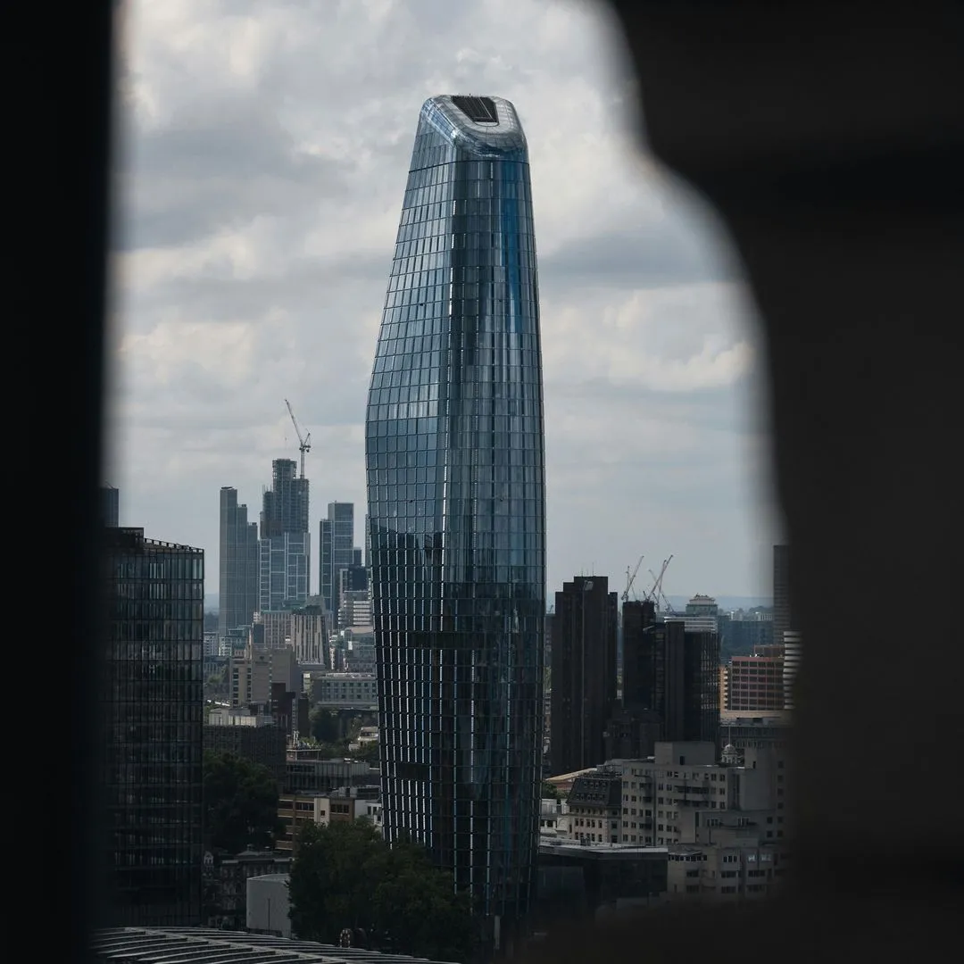 Glass tower above a city skyline