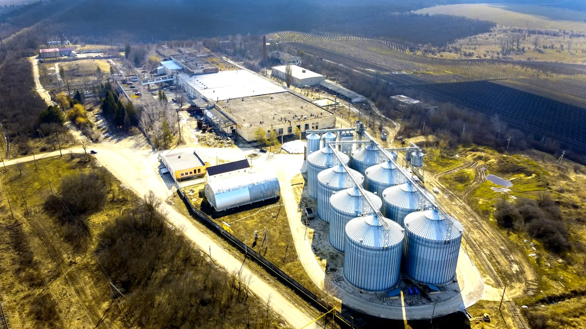 Aerial view of an industrial plant with storage silos
