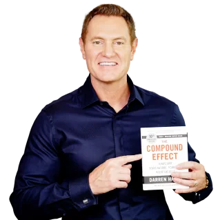 Darren Hardy holding The Compound Effect