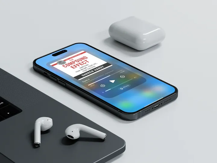 The extended audiobook on a phone with earbuds