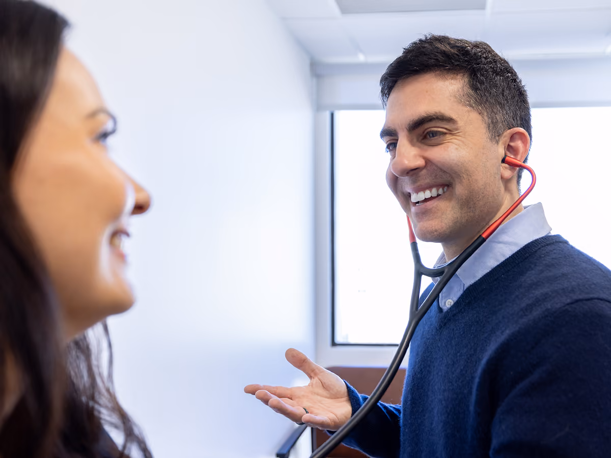 Dr. Omeed Warej examining a patient at California Heart & Health