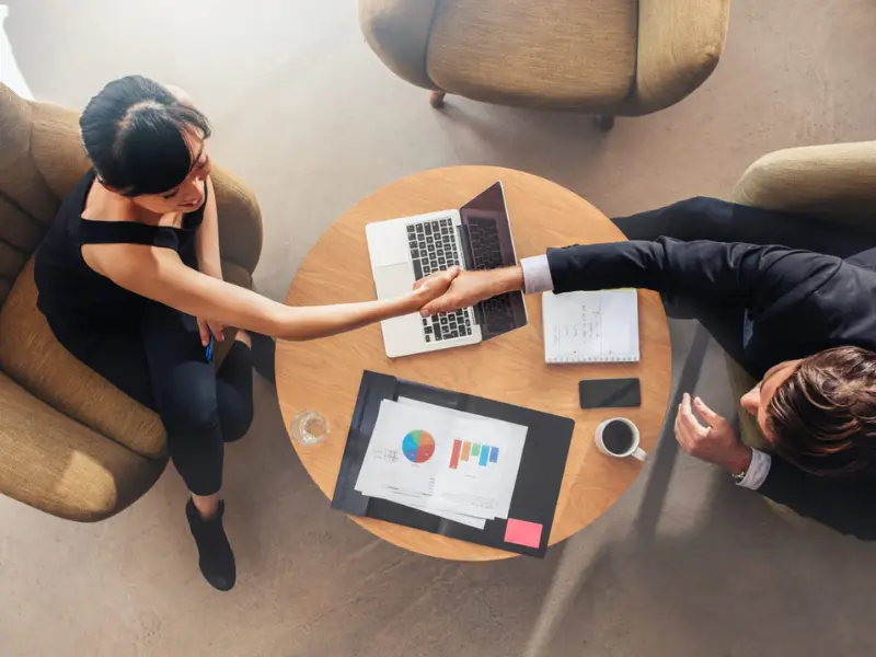 Capitis Lending Man and Woman shaking hands
