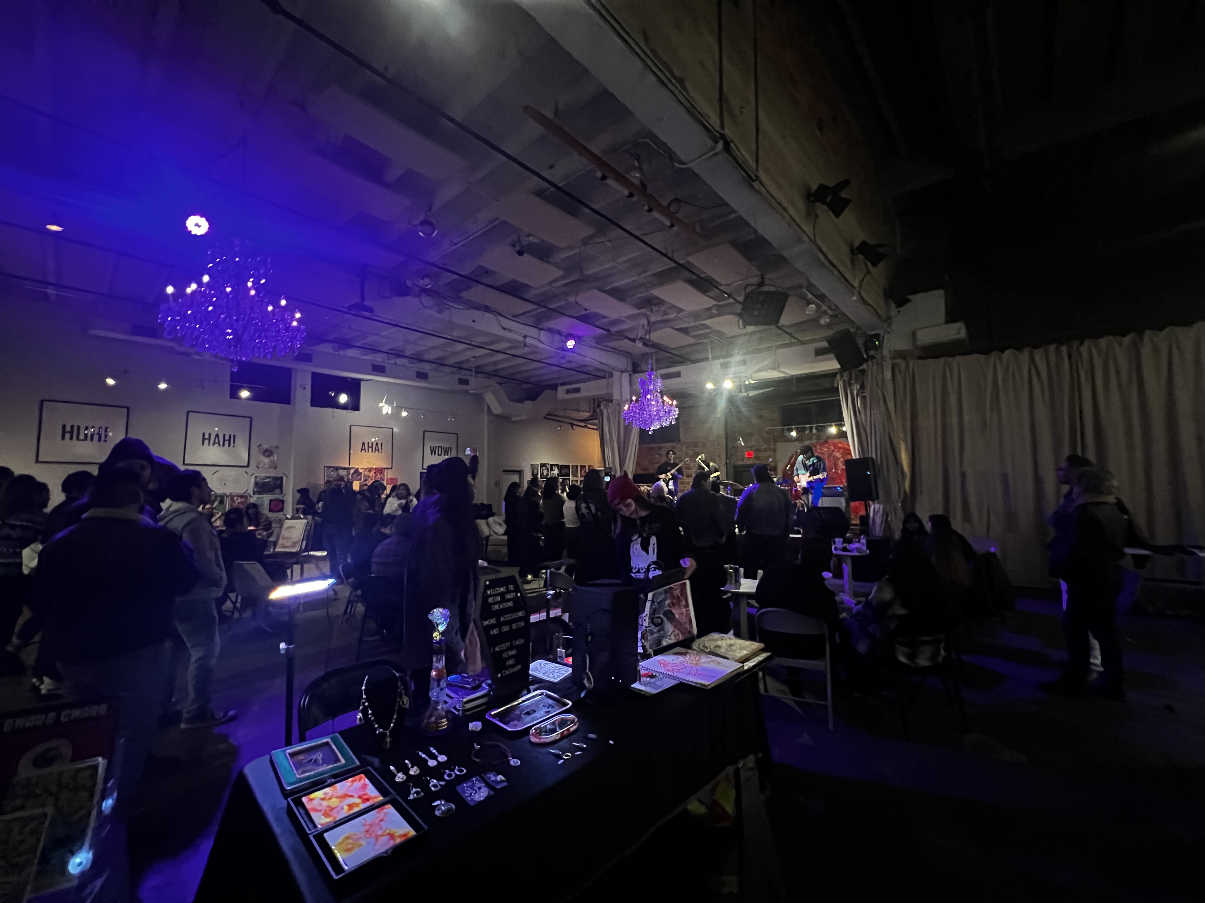 Guests and a DJ at an event night in the main hall at 108 Blue Star