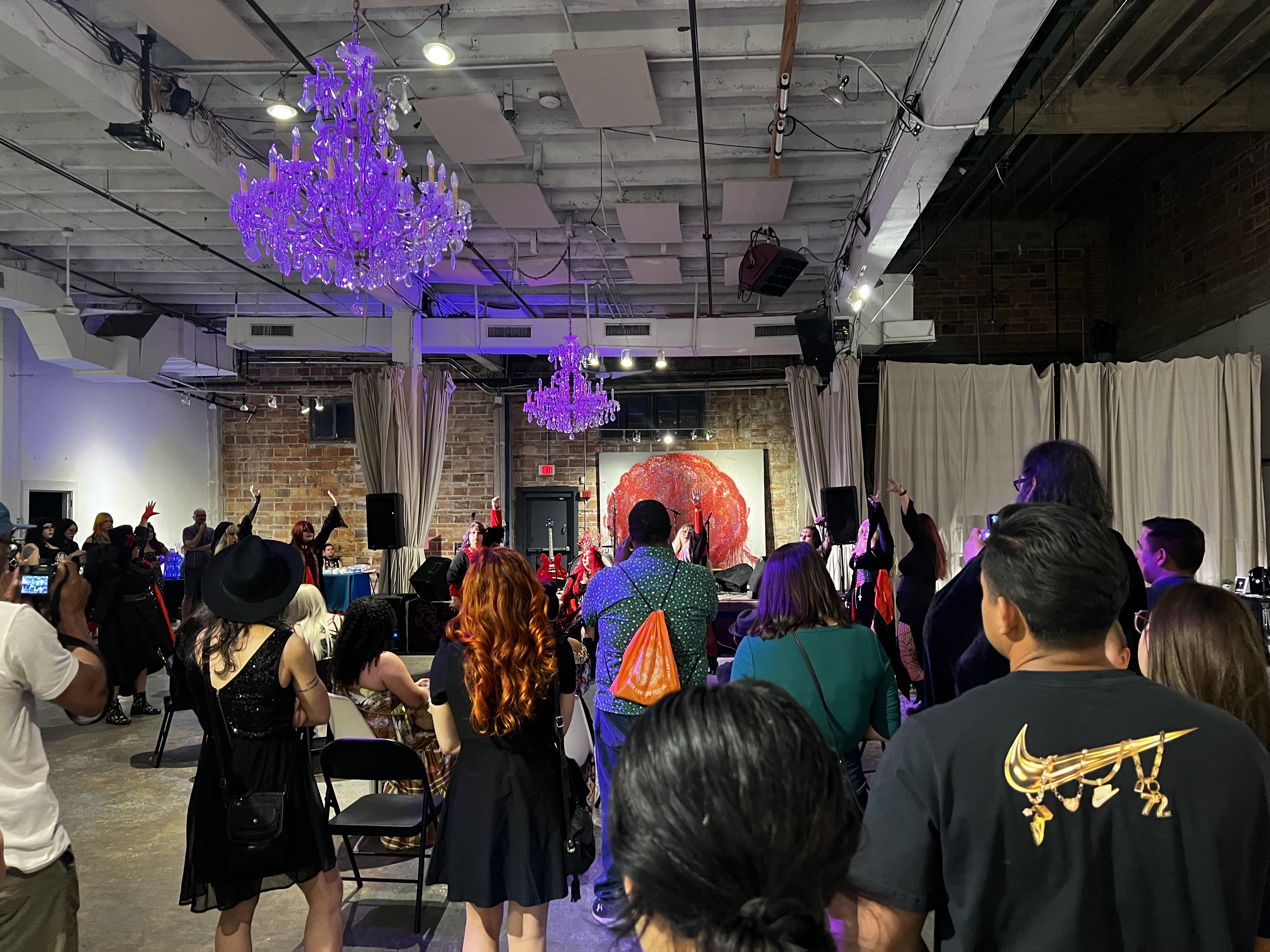 Guests standing and dancing at an event night at 108 Blue Star