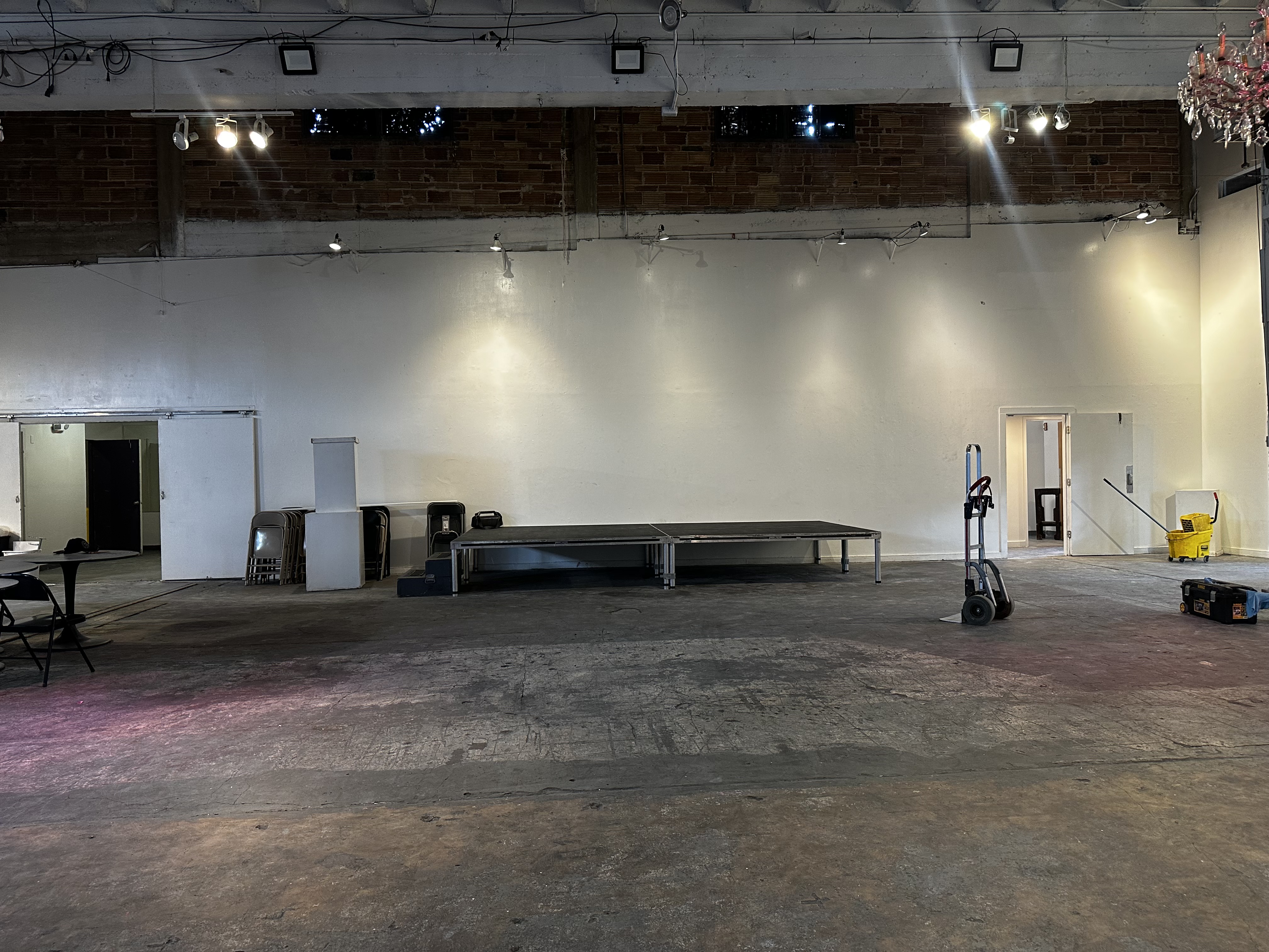 The main hall at 108 Blue Star set with a low stage platform