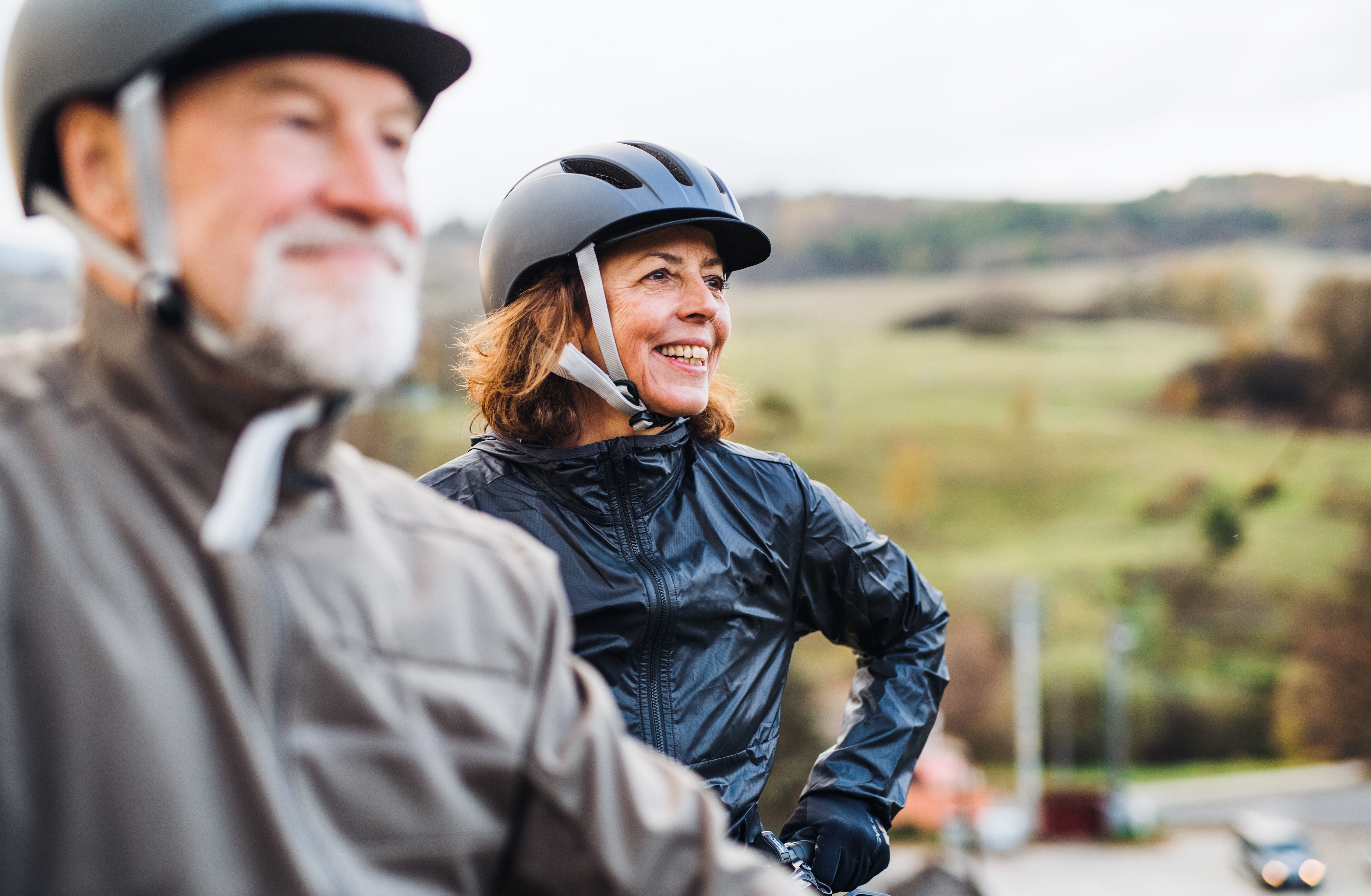 Man and woman riding a bike stock image