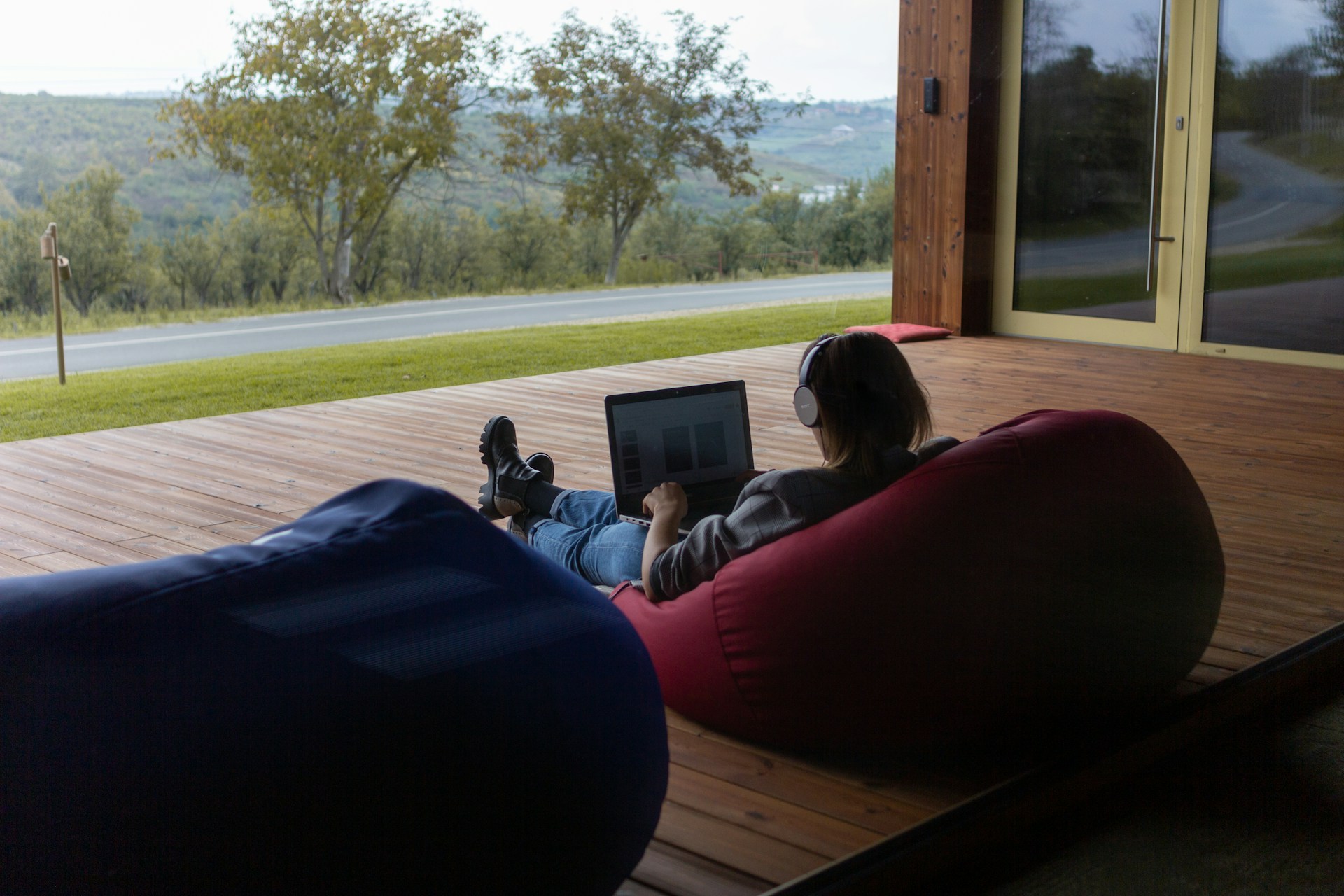 Participant completing accredited online positive psychology course in relaxed home environment with guided audio support.
