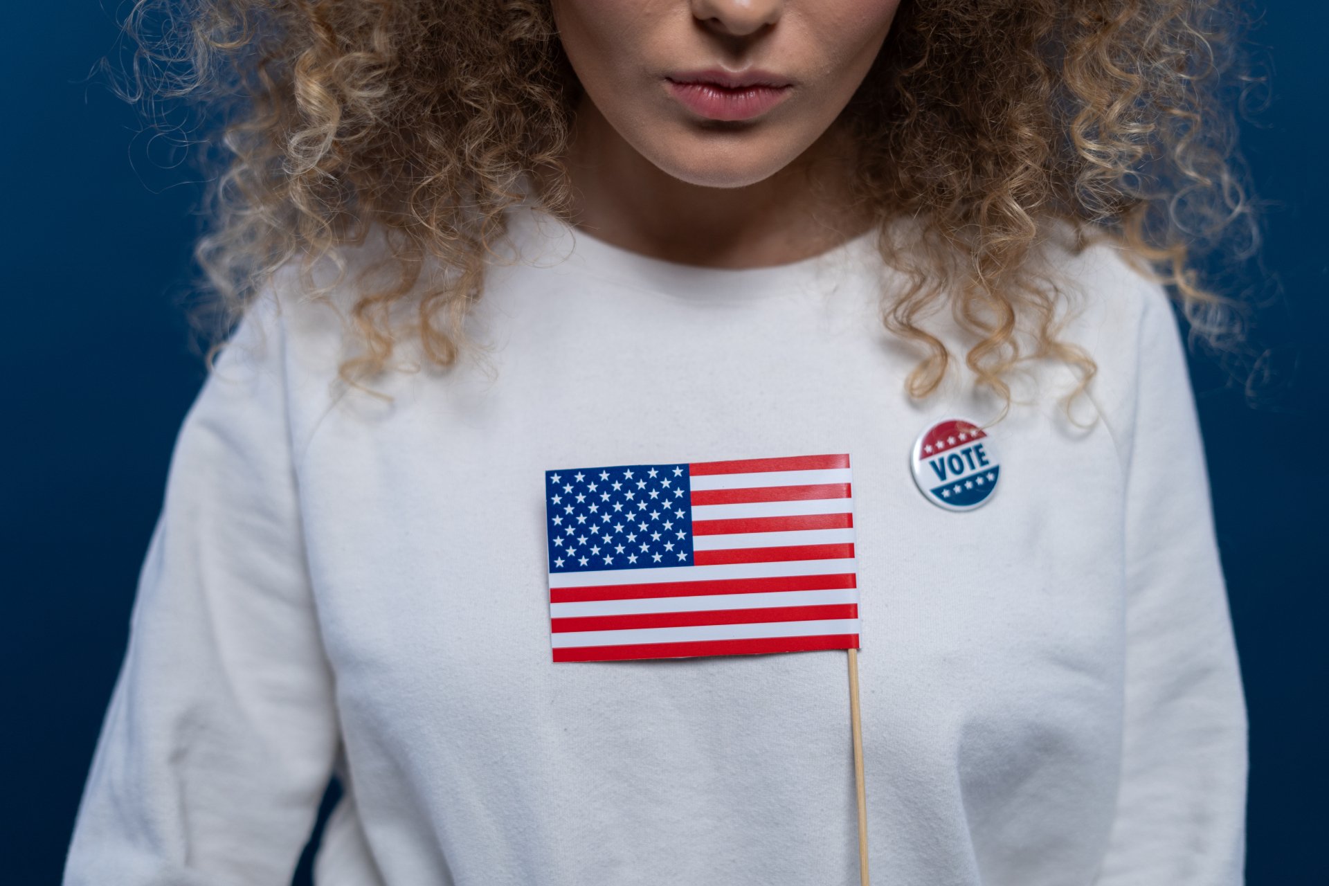 married woman holding an American flag
