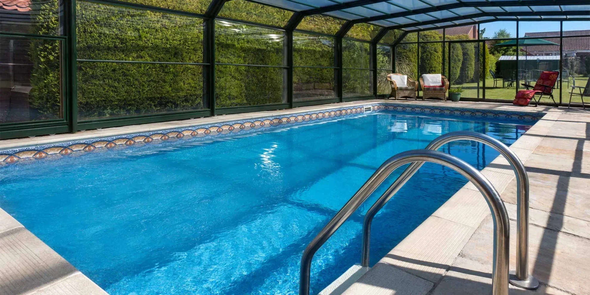 Backyard swimming pool at dusk