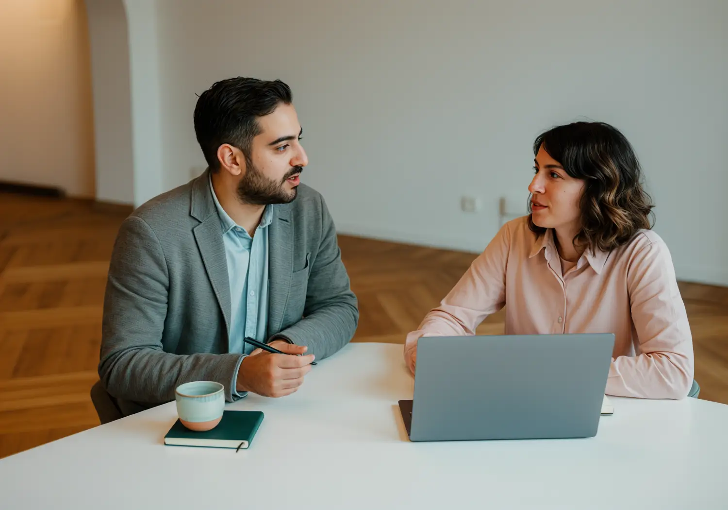 Business professionals in a meeting around a table