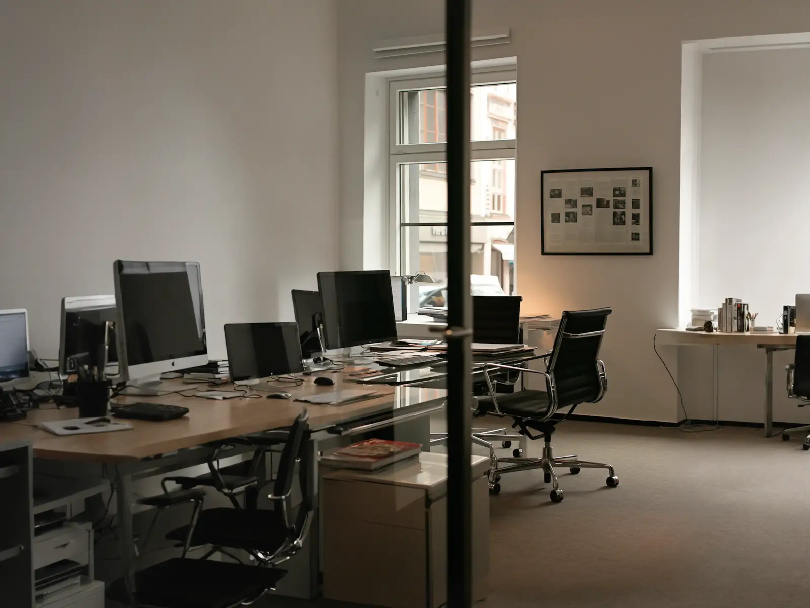 A modern open-plan office interior with desks