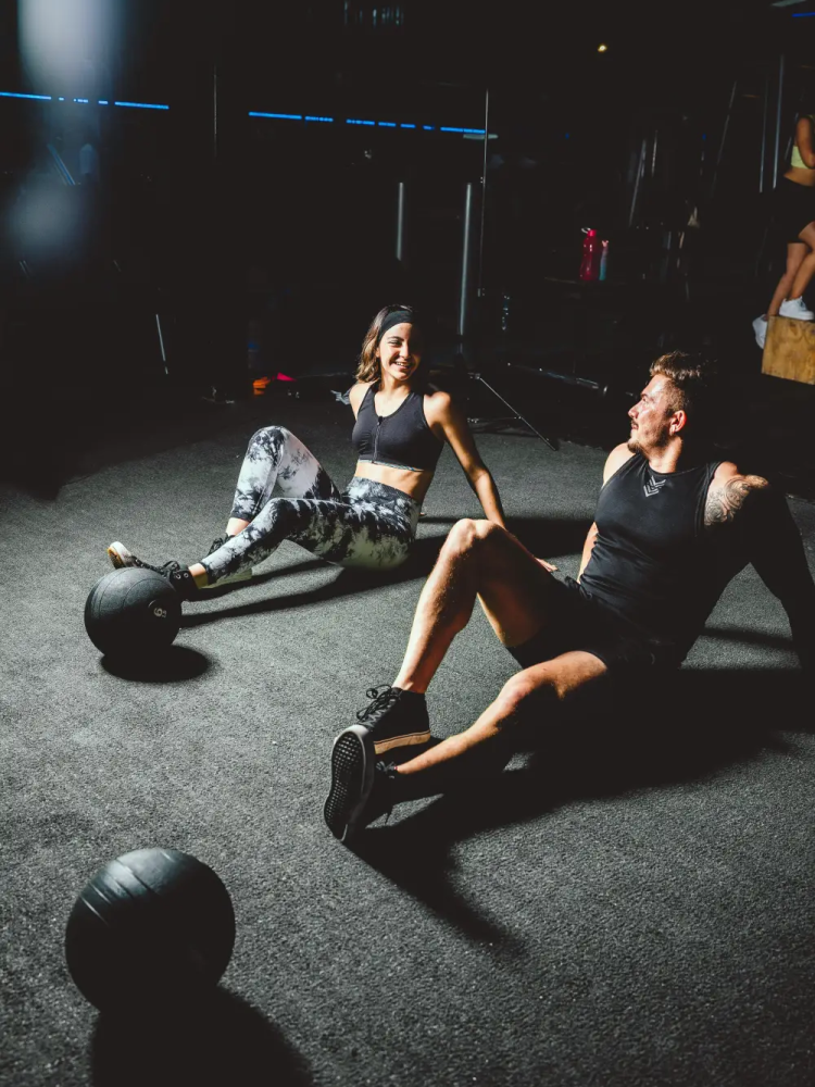 Coach guiding a member at CrossFit Riverside (mobile)