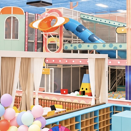 Centre of the play area with a ringed-planet climber, blue slide and balloons