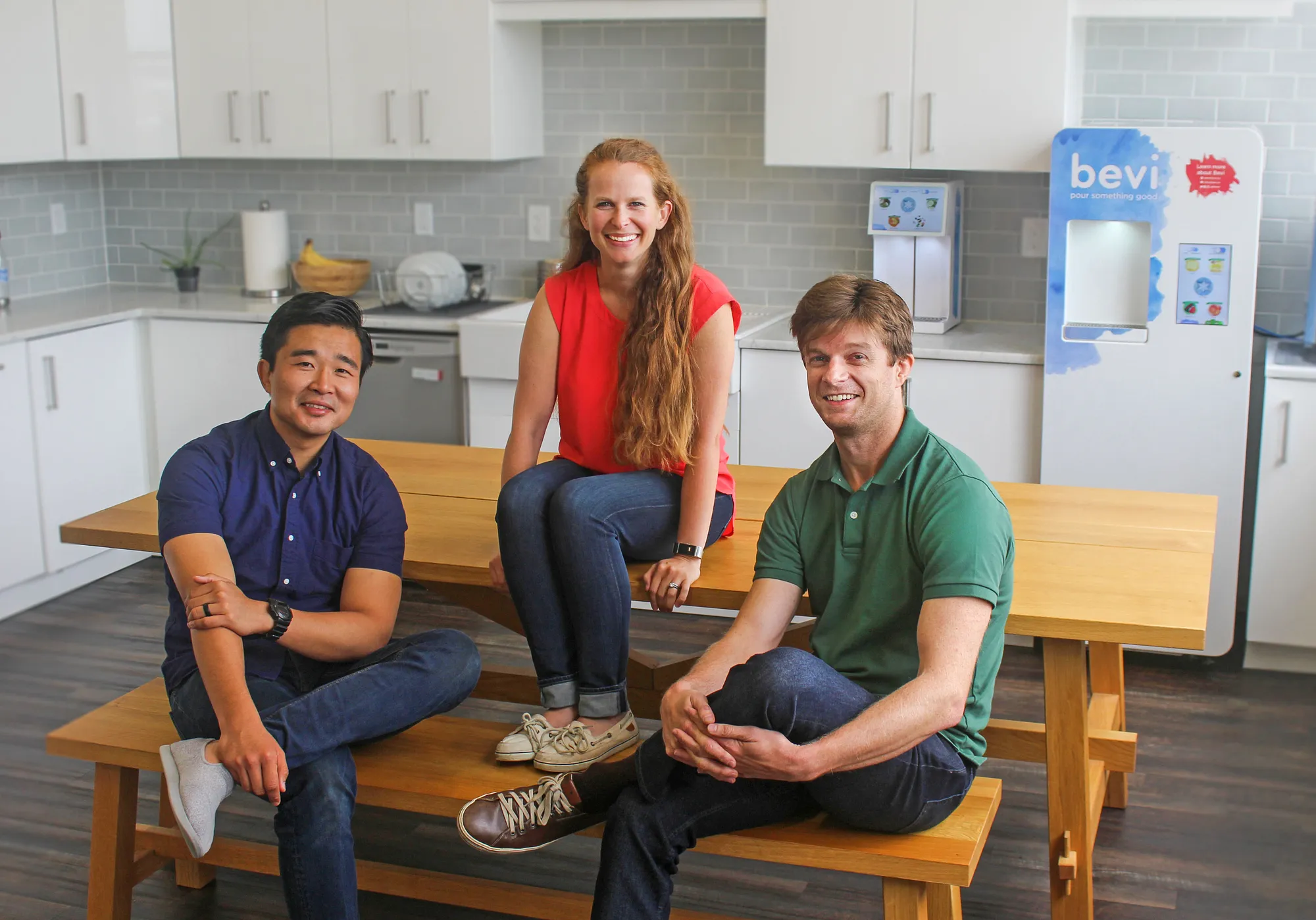 Bevi’s founders (Eliza Becton, Sean Grundy and Frank Lee) with the Bevi dispenser