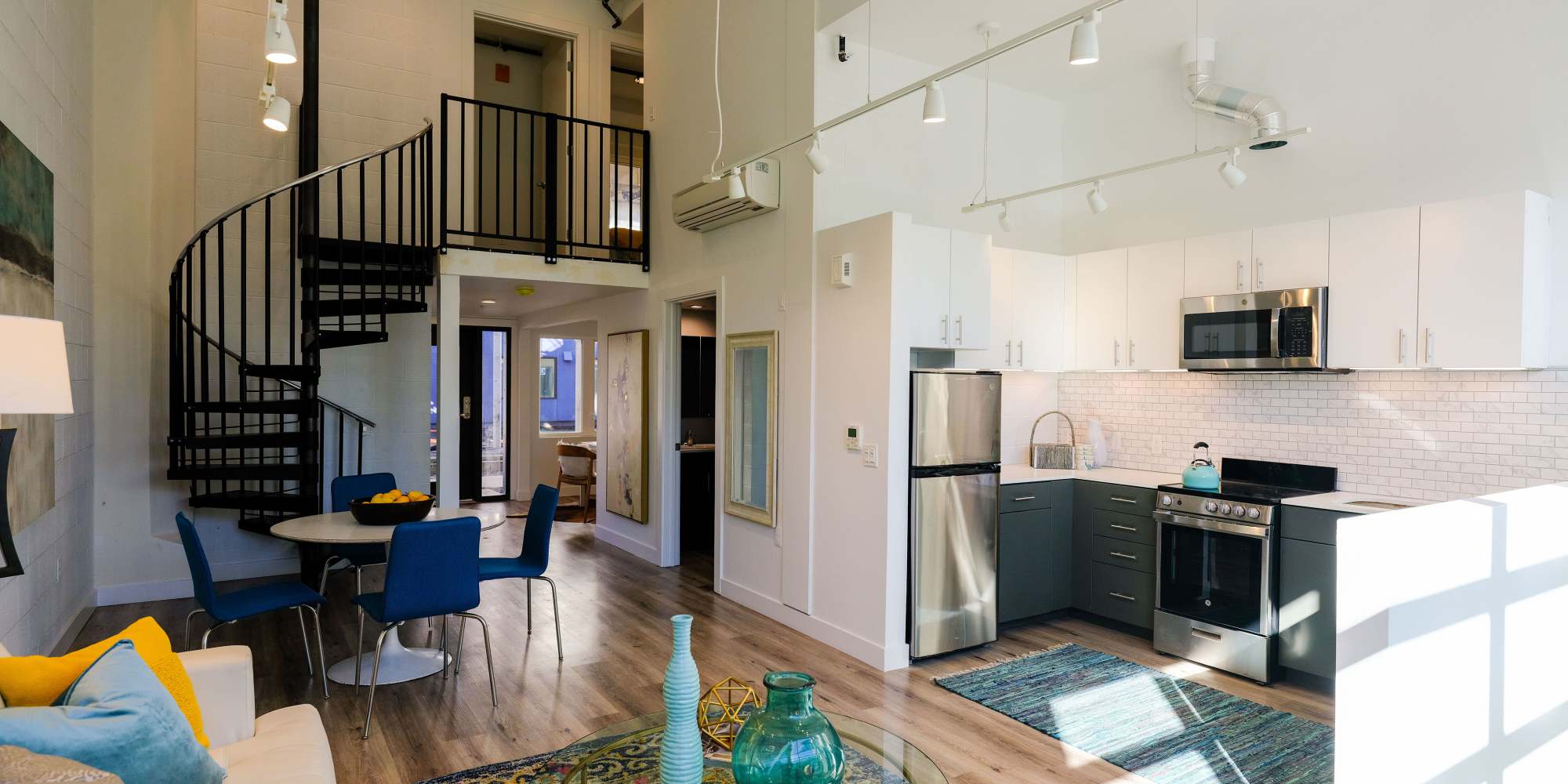 Living room with spiral stair case