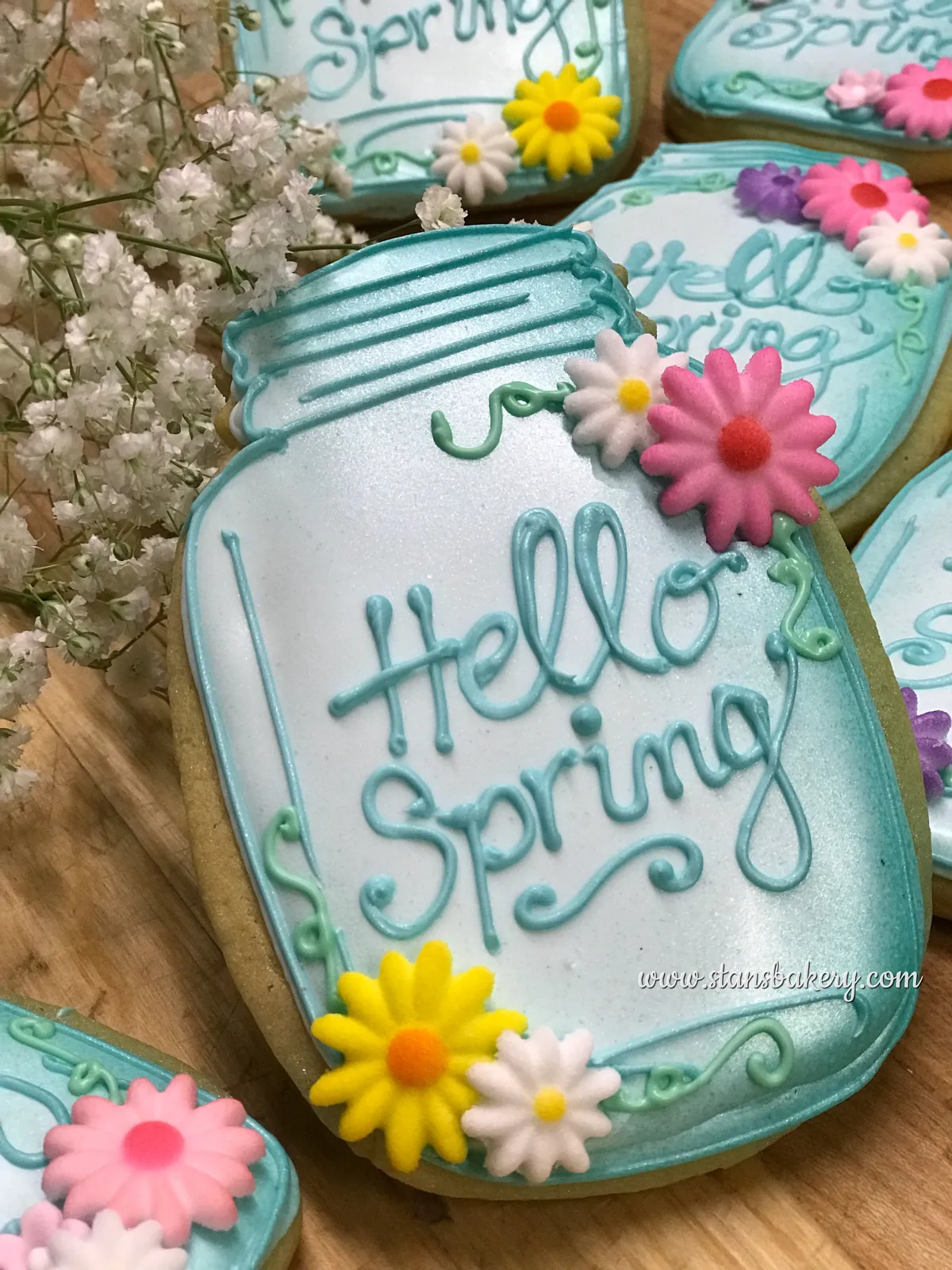 A mason jar cookie lettered Hello Spring