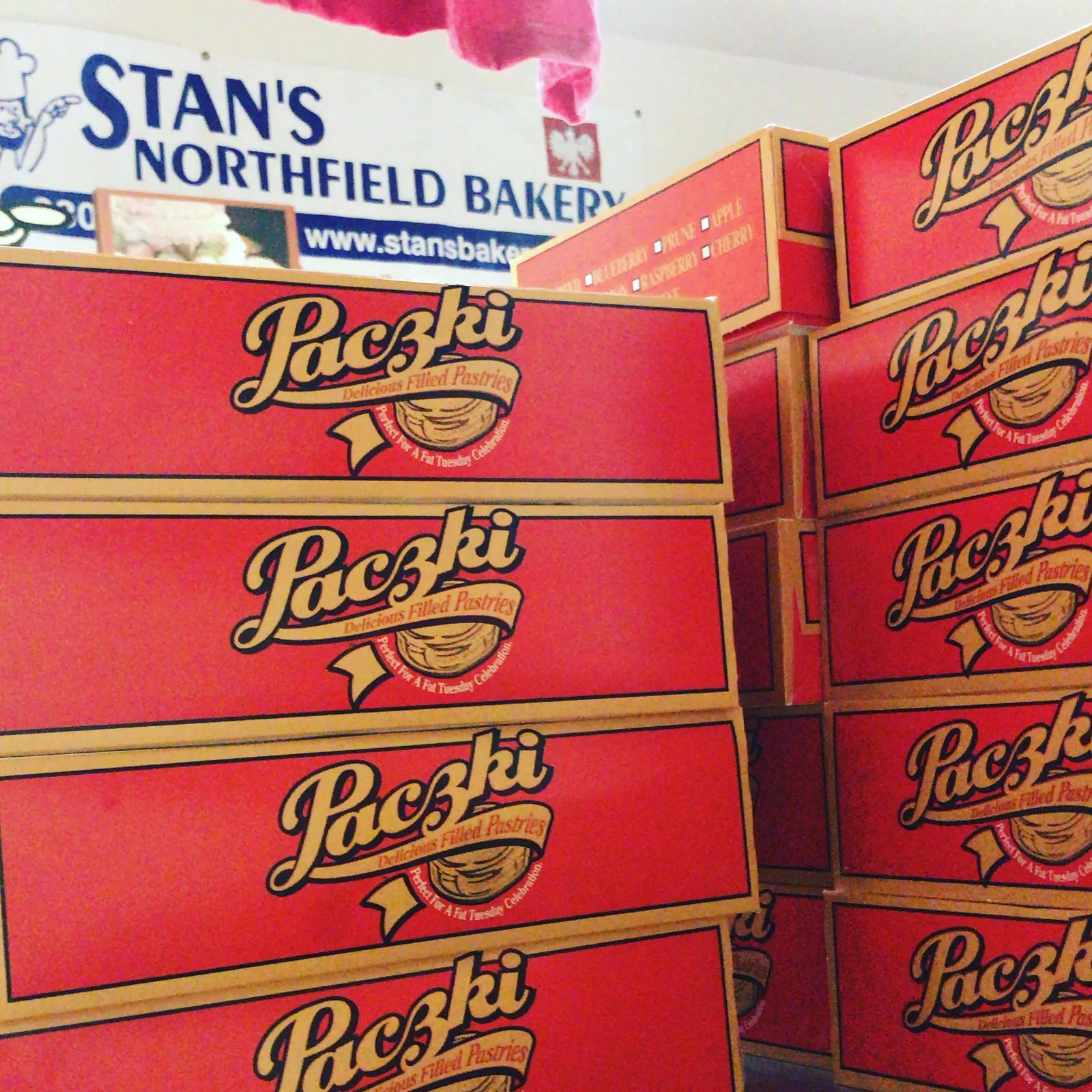 Stacks of Stan's red pączki boxes