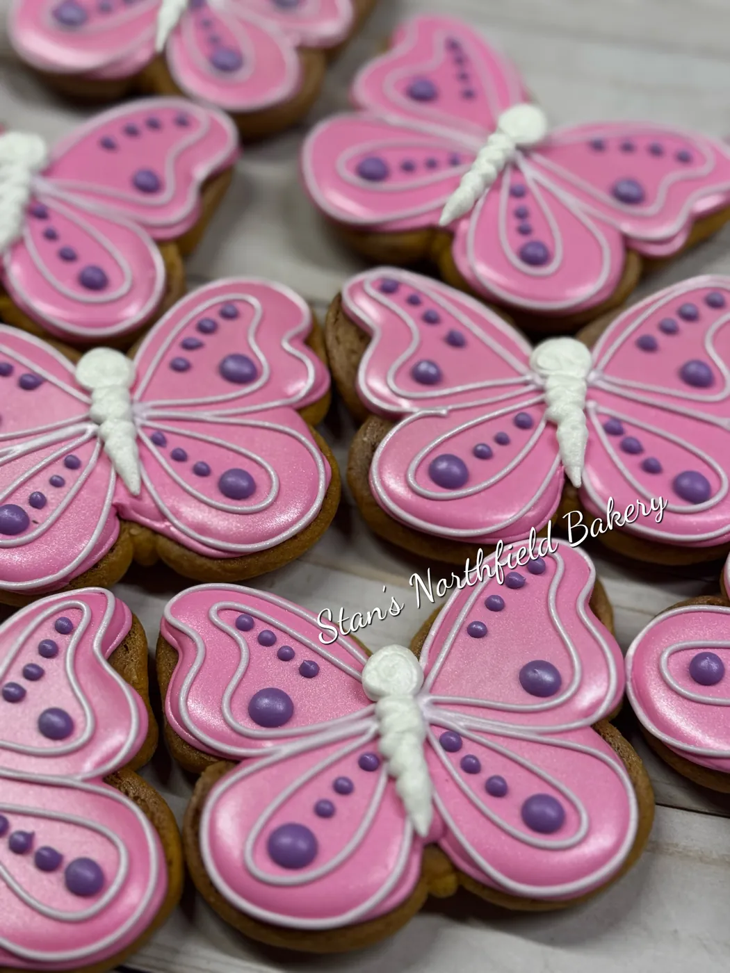 Pink and purple butterfly cookies with piped string work